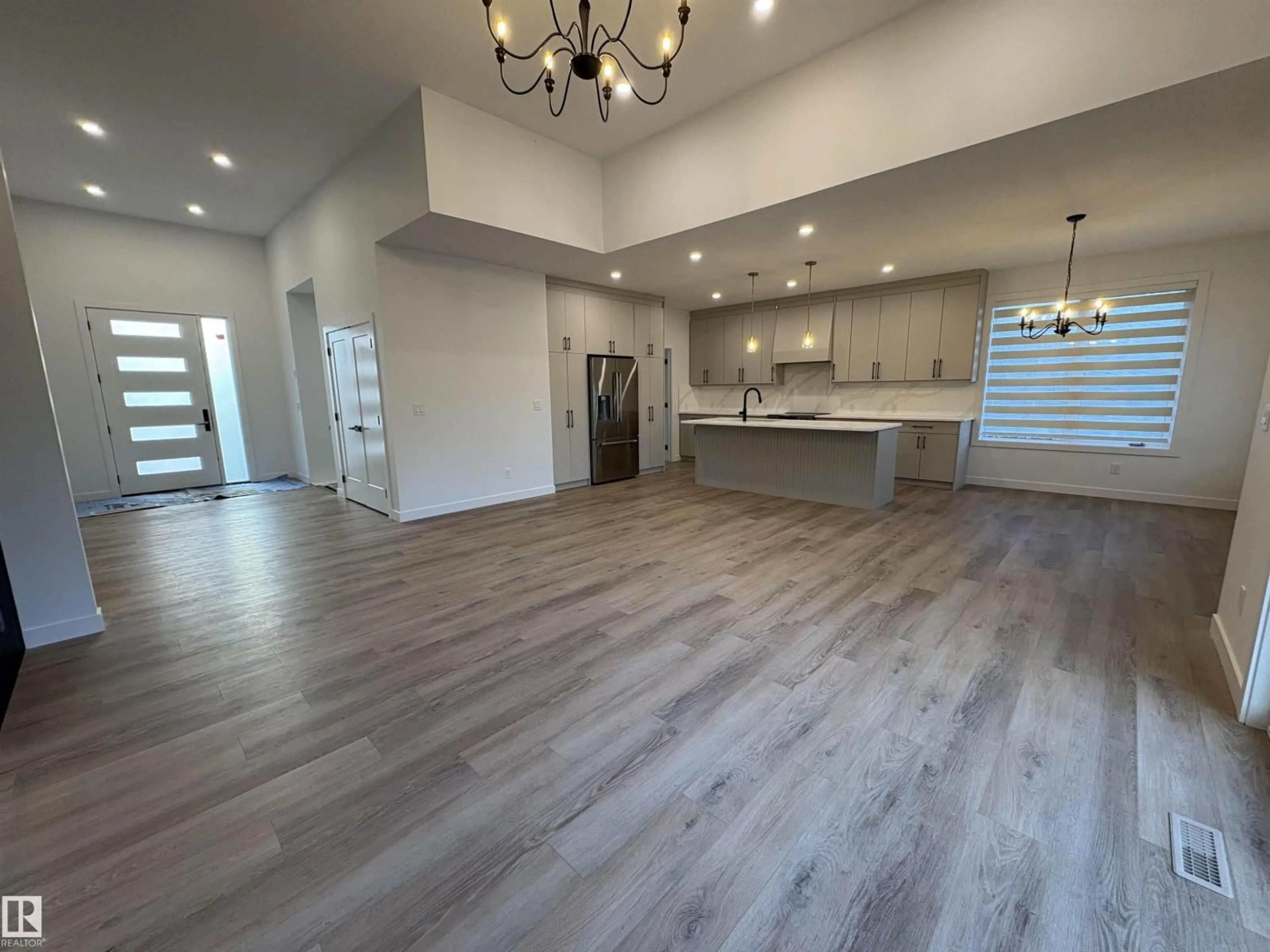 Open concept kitchen, wood/laminate floor for 50418 - 277 RGE RD 202, Rural Beaver County Alberta T0B4J2