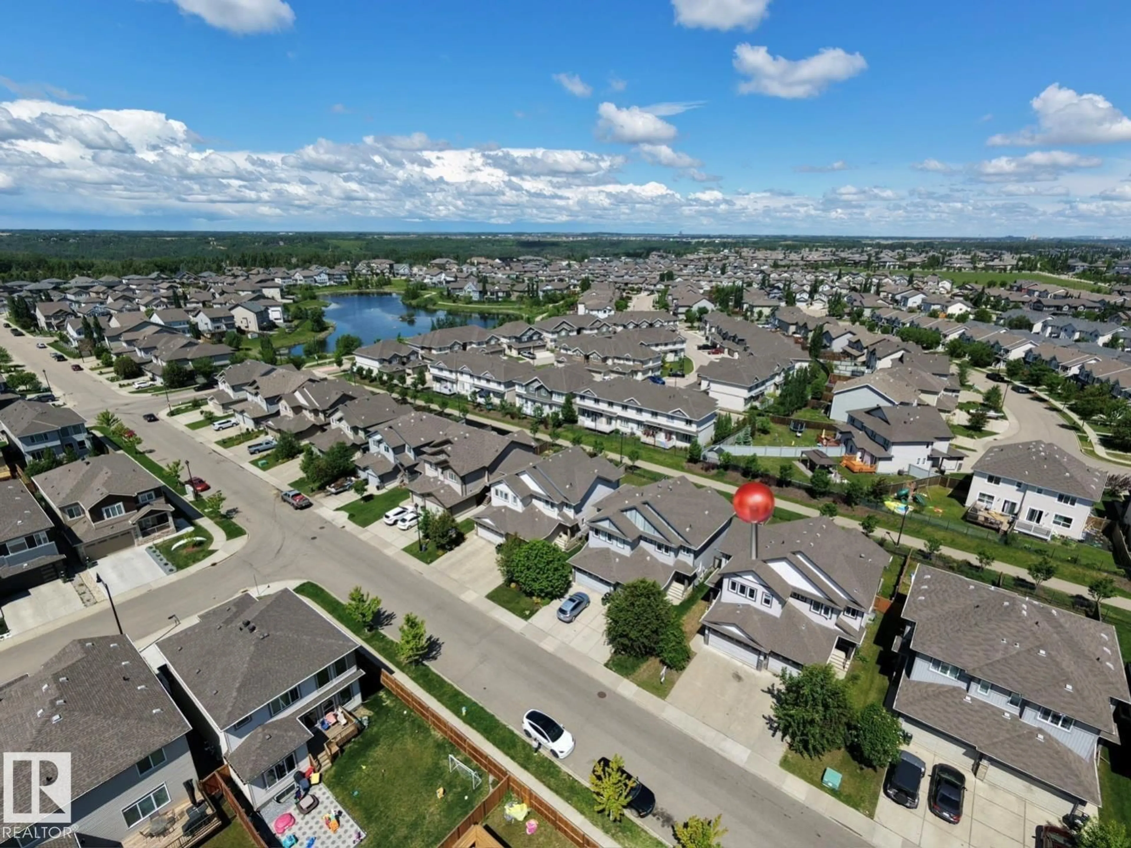 A pic from outside/outdoor area/front of a property/back of a property/a pic from drone, water/lake/river/ocean view for 17614 8 AVENUE SW, Edmonton Alberta T6W2X3