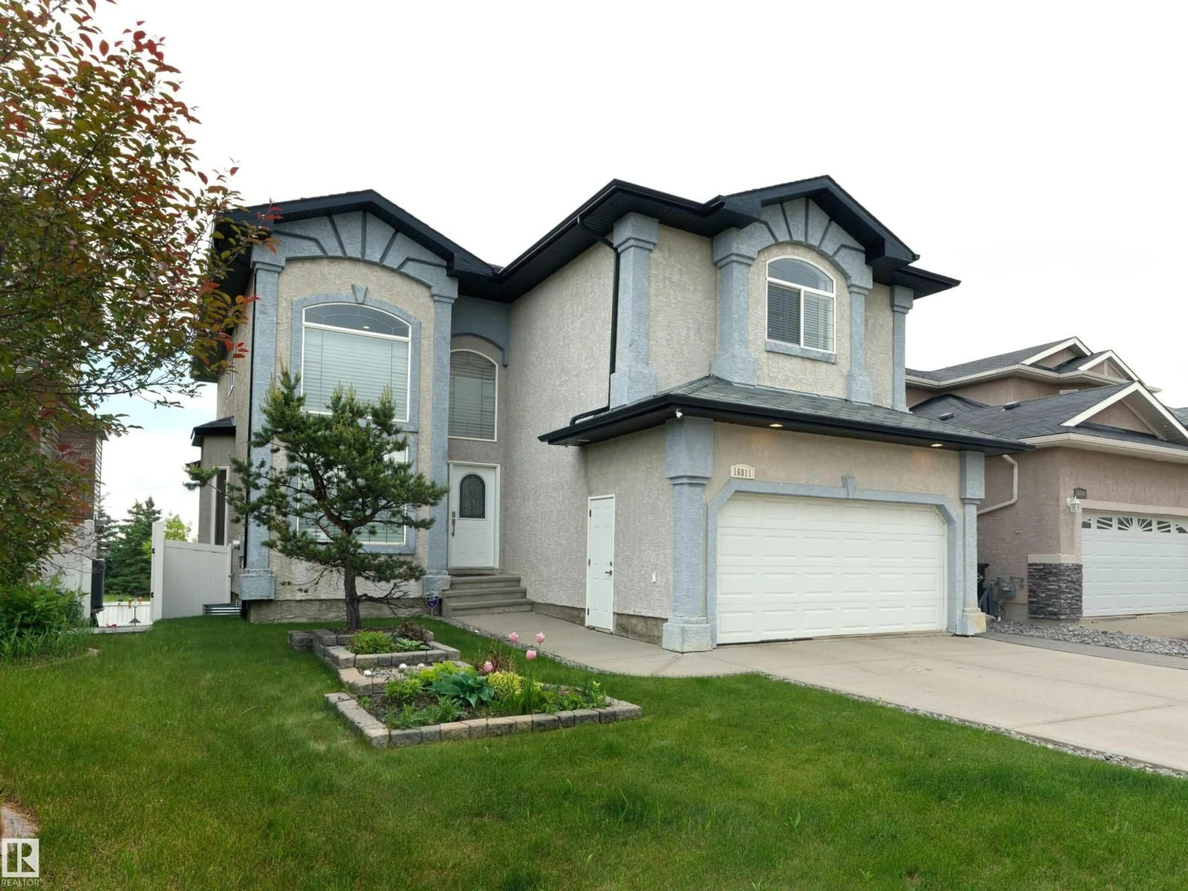 Home with vinyl exterior material, street for 16011 46 ST, Edmonton Alberta T5Y0G9