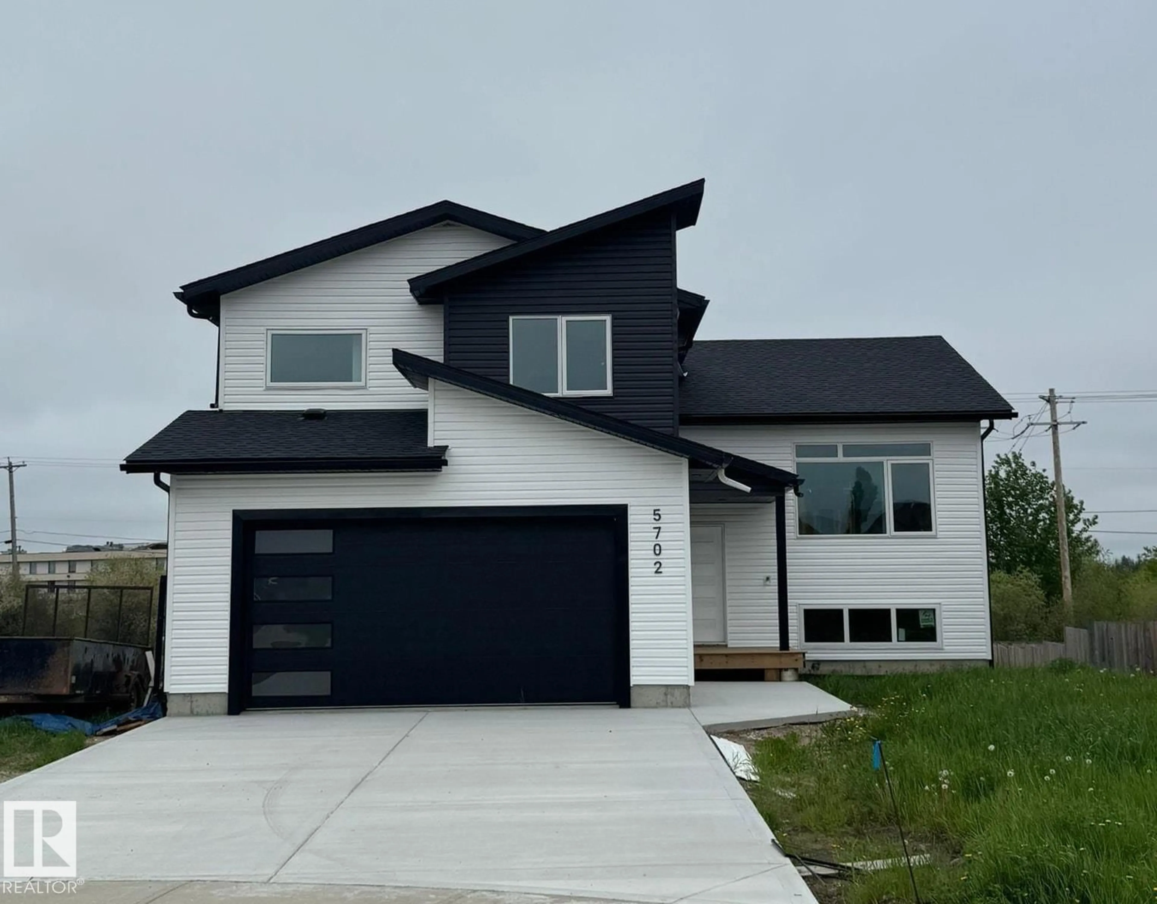 Home with vinyl exterior material, street for 5702 MEADOW WY, Cold Lake Alberta T9M0E8