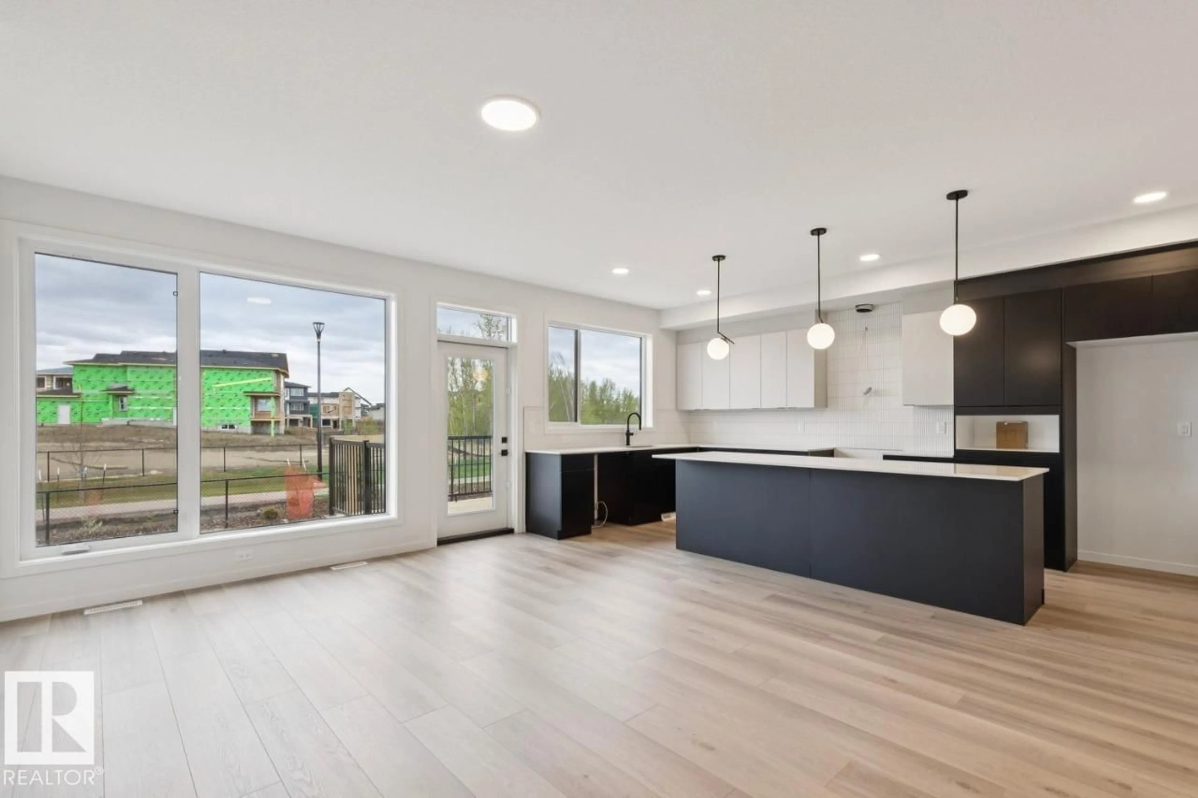 Open concept kitchen, wood/laminate floor for 7351 KLAPSTEIN CR, Edmonton Alberta T6W5R8
