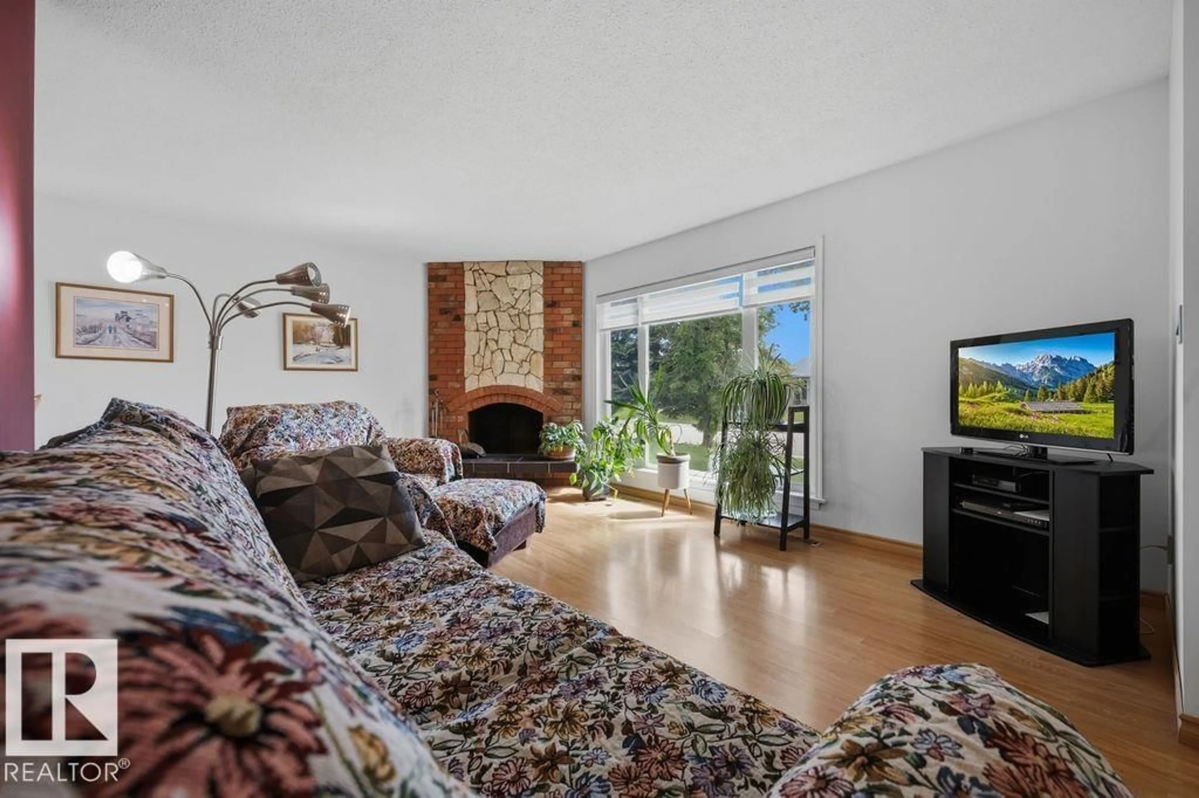 Living room with furniture, unknown for NW - 14612 117A ST, Edmonton Alberta T5X1K2