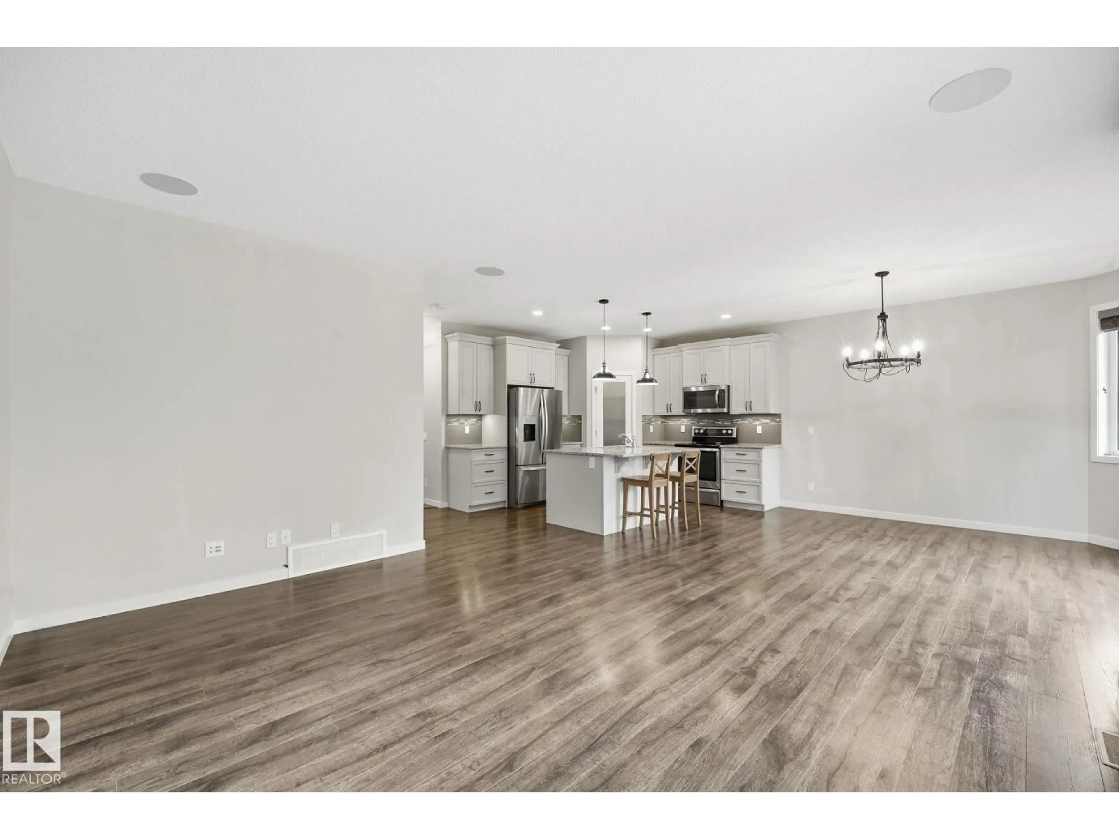 Open concept kitchen, wood/laminate floor for 33 RIVIERE TC, St. Albert Alberta T8N7N9