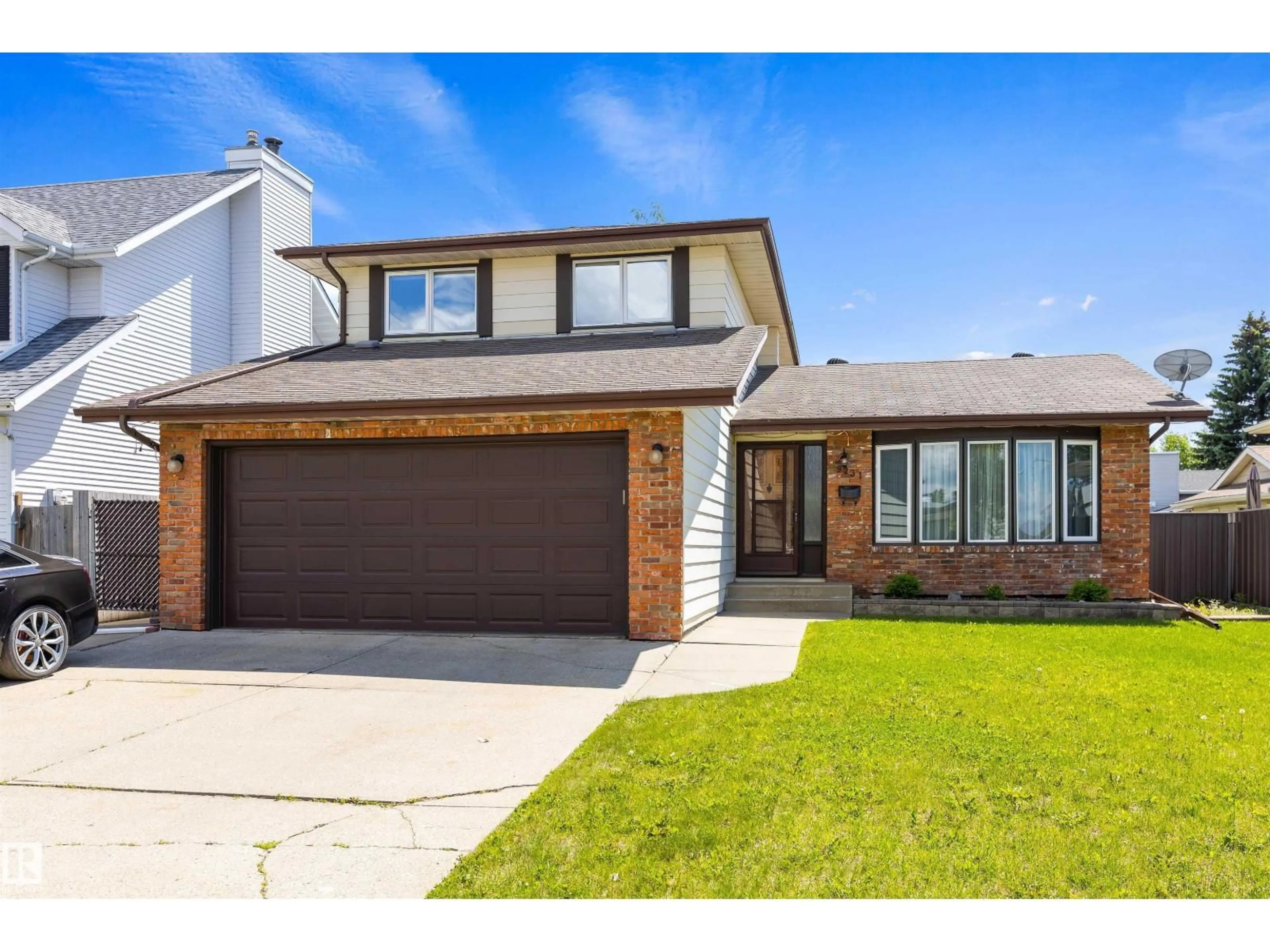 Home with brick exterior material, street for 9231 169 AV, Edmonton Alberta T5Z1W7
