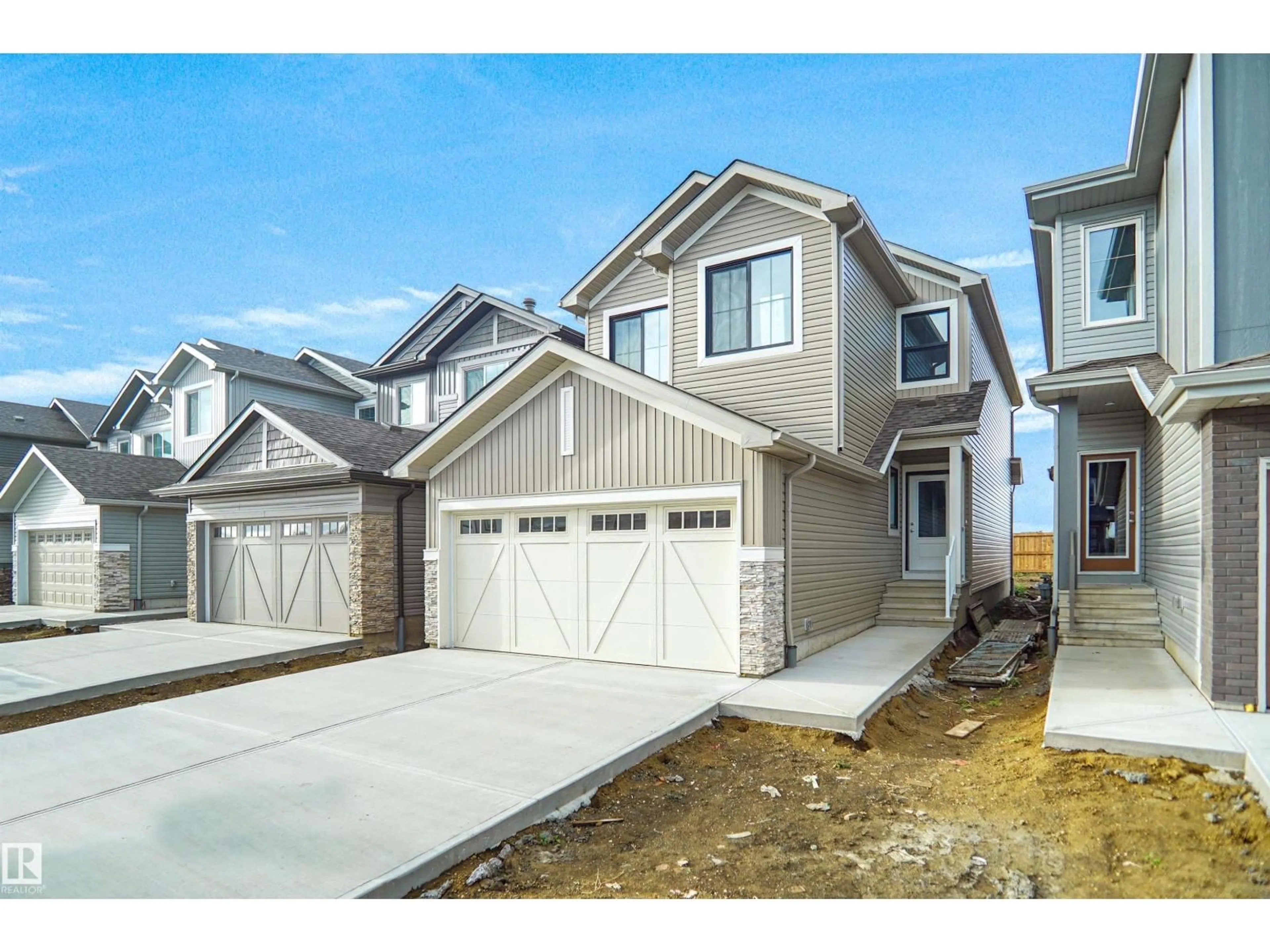 Home with vinyl exterior material, street for 20924 16 AV, Edmonton Alberta T6M1P7