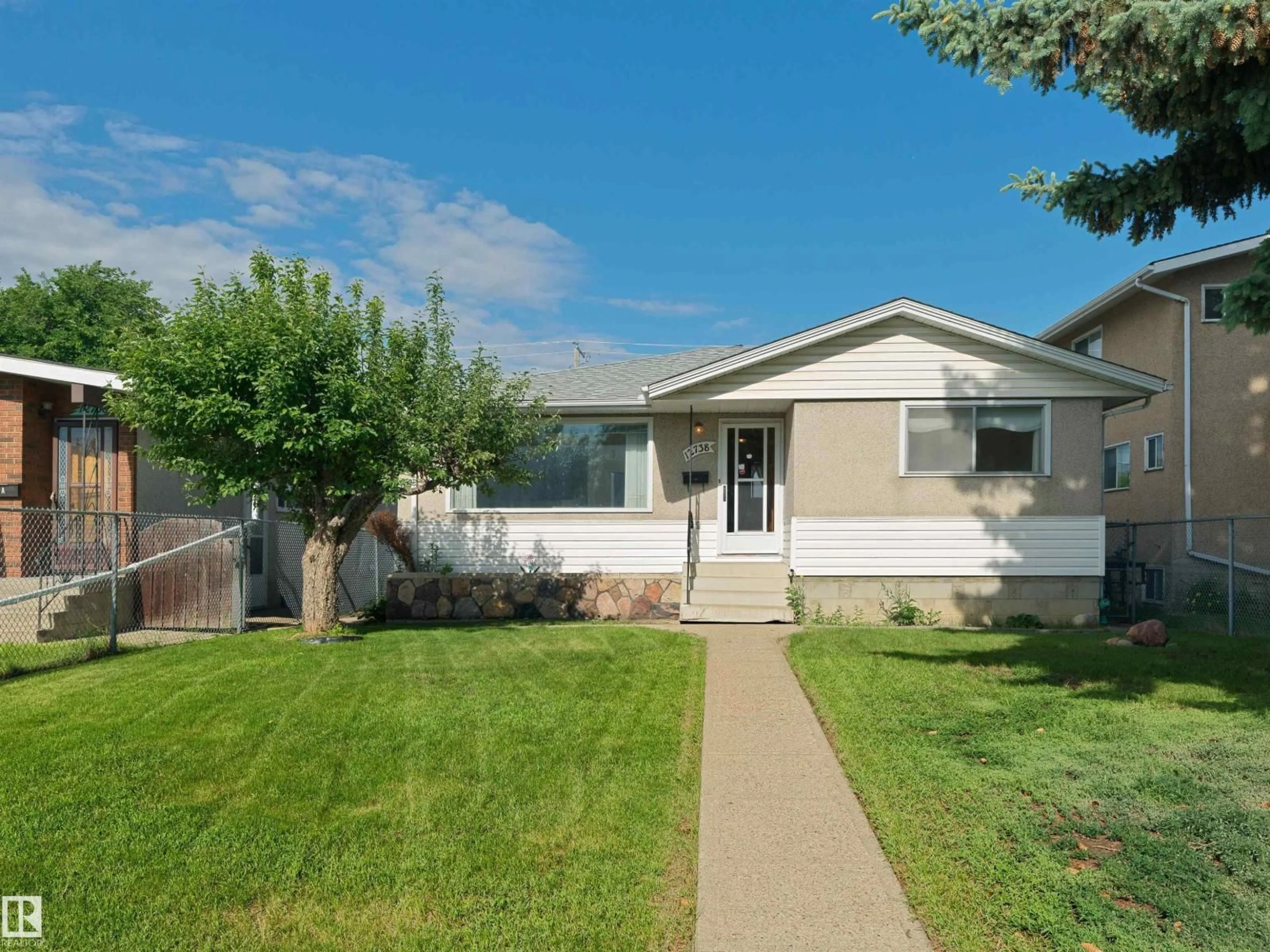 Home with vinyl exterior material, street for 12738 88 ST, Edmonton Alberta T5E3H1