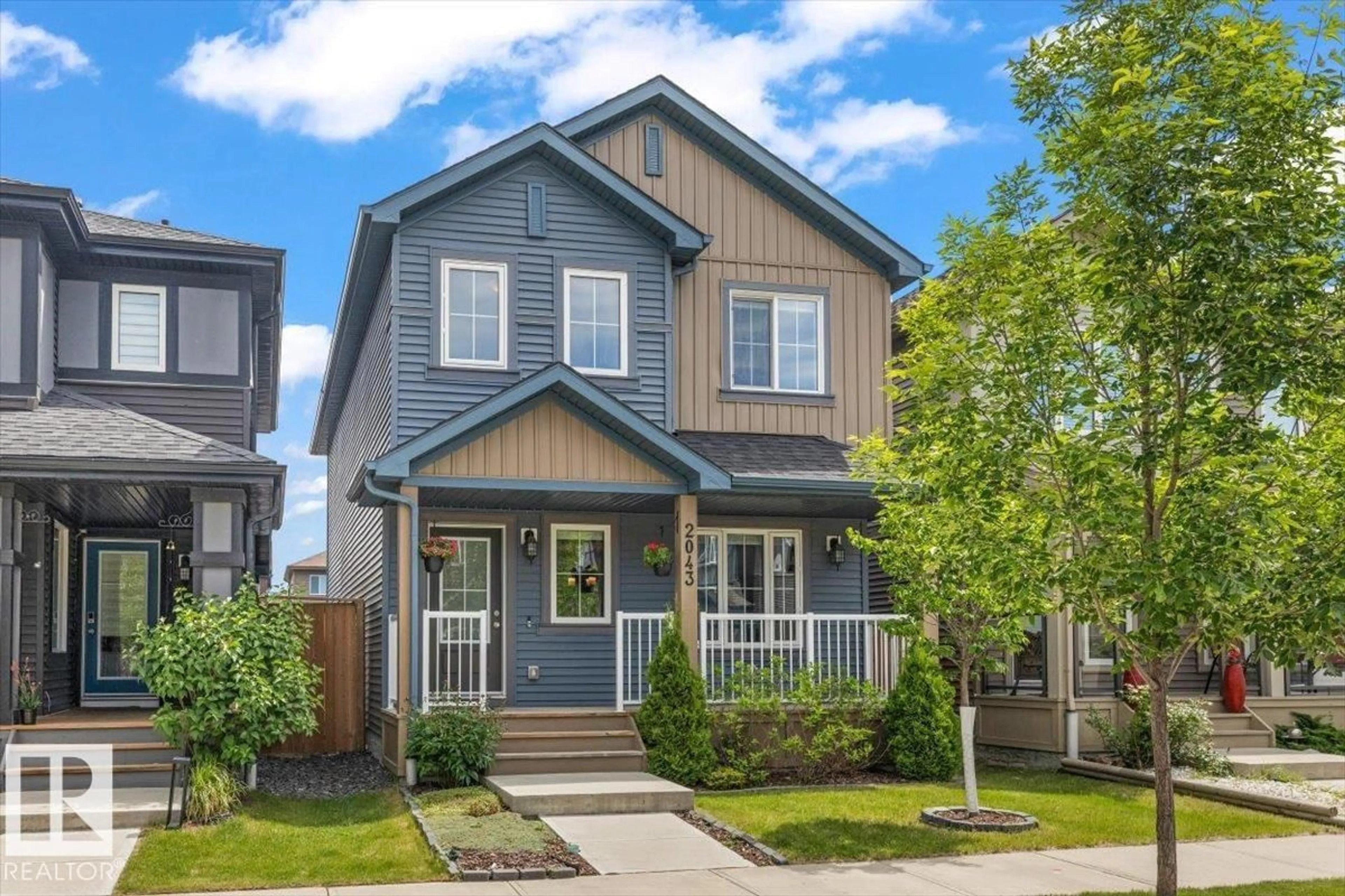 Home with vinyl exterior material, street for 2043 GRAYDON HILL CR, Edmonton Alberta T6W4C5