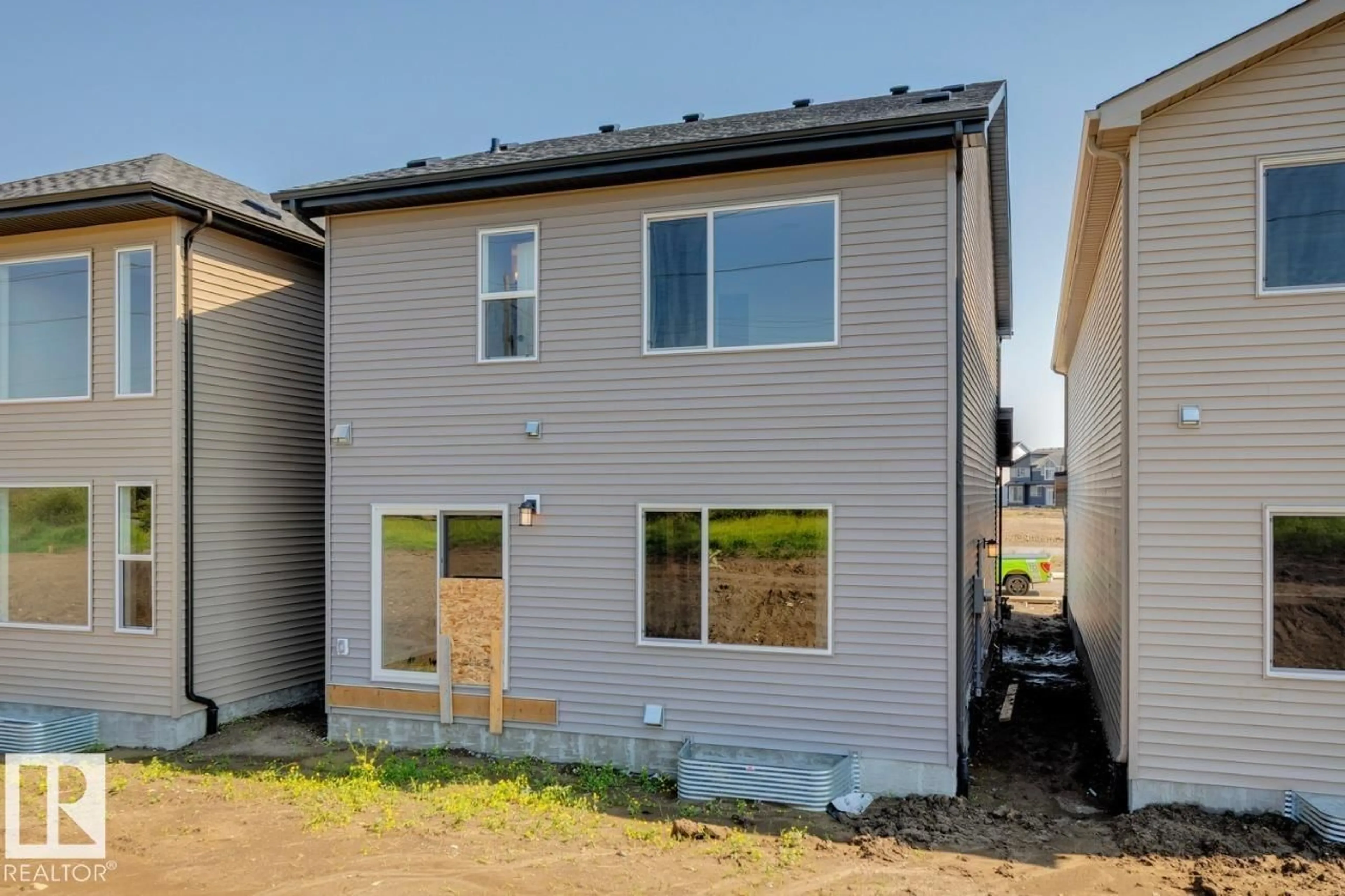 Home with vinyl exterior material, street for NW - 17328 5 ST, Edmonton Alberta T5Y6G4