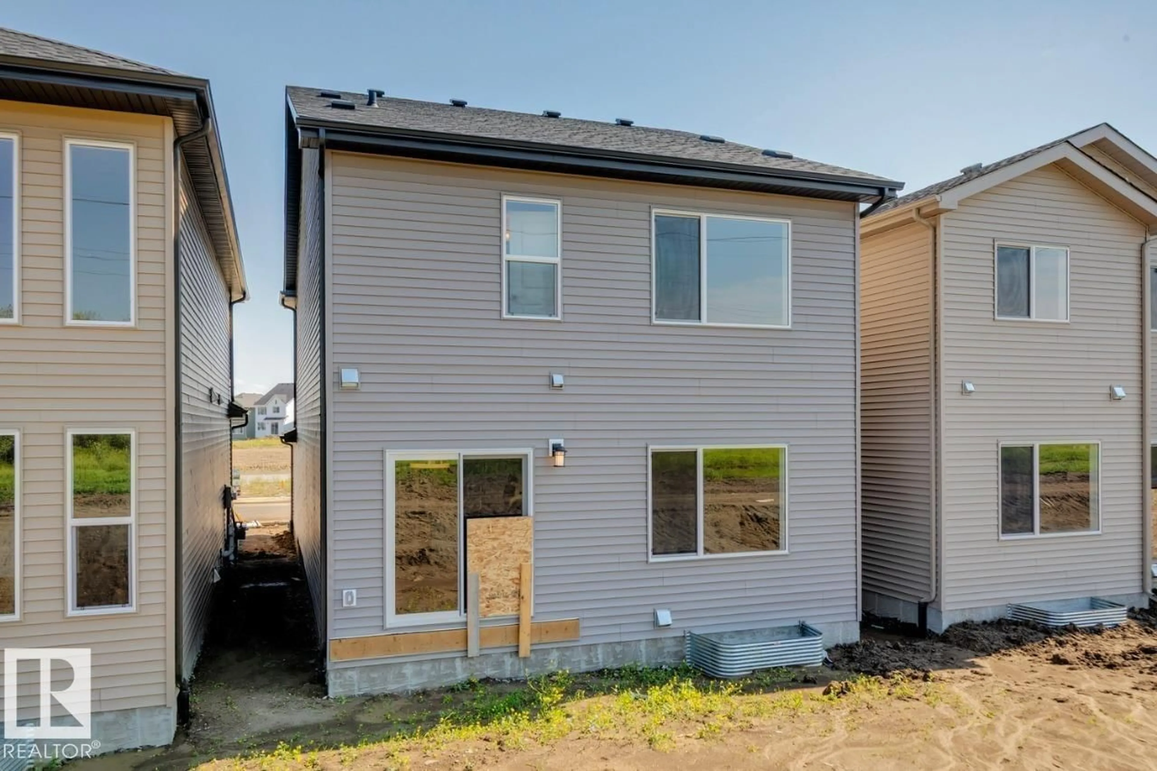 Home with vinyl exterior material, street for NW - 17328 5 ST, Edmonton Alberta T5Y6G4