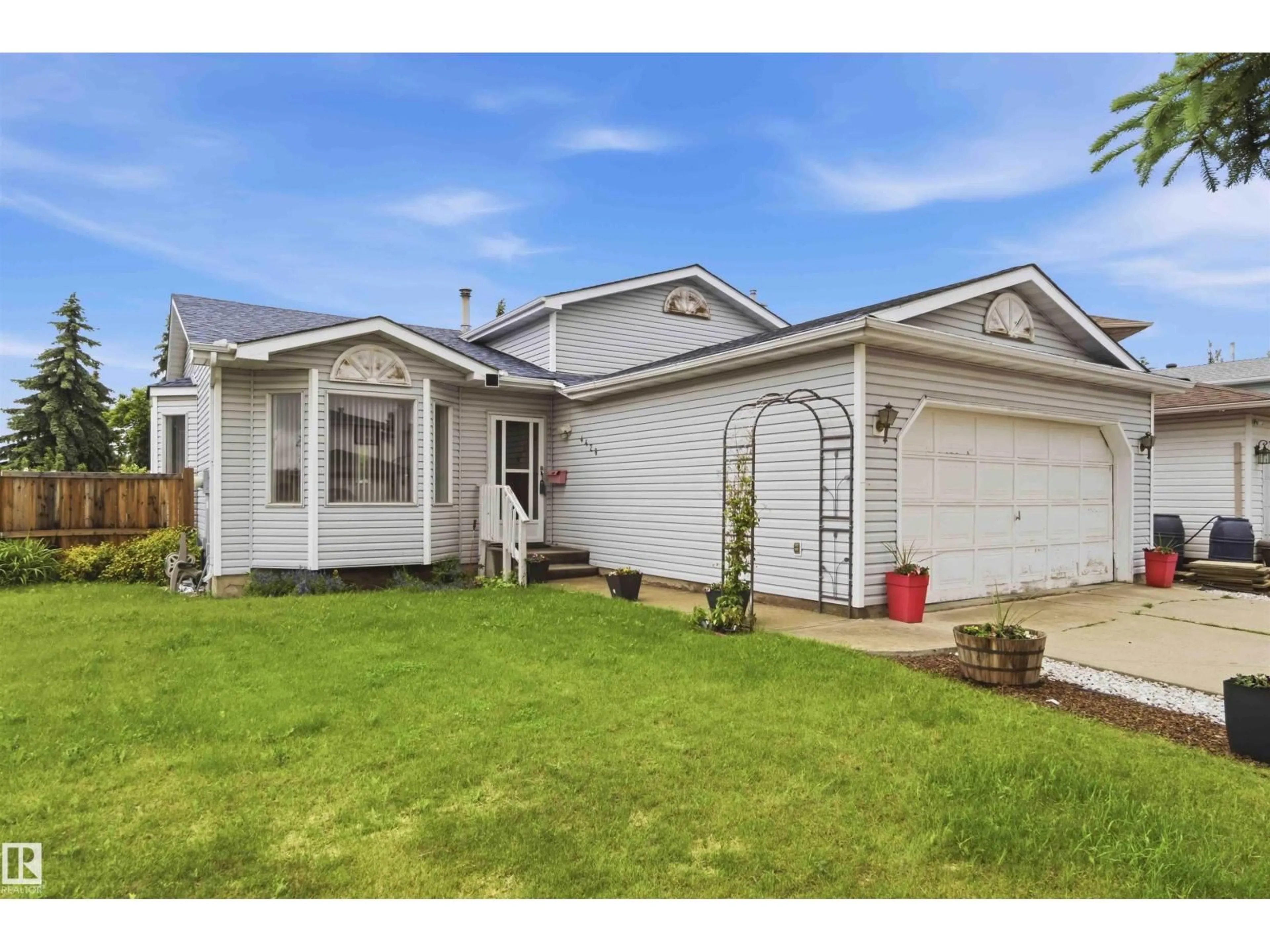 Home with vinyl exterior material, street for 4428 11A AV, Edmonton Alberta T6L6M4