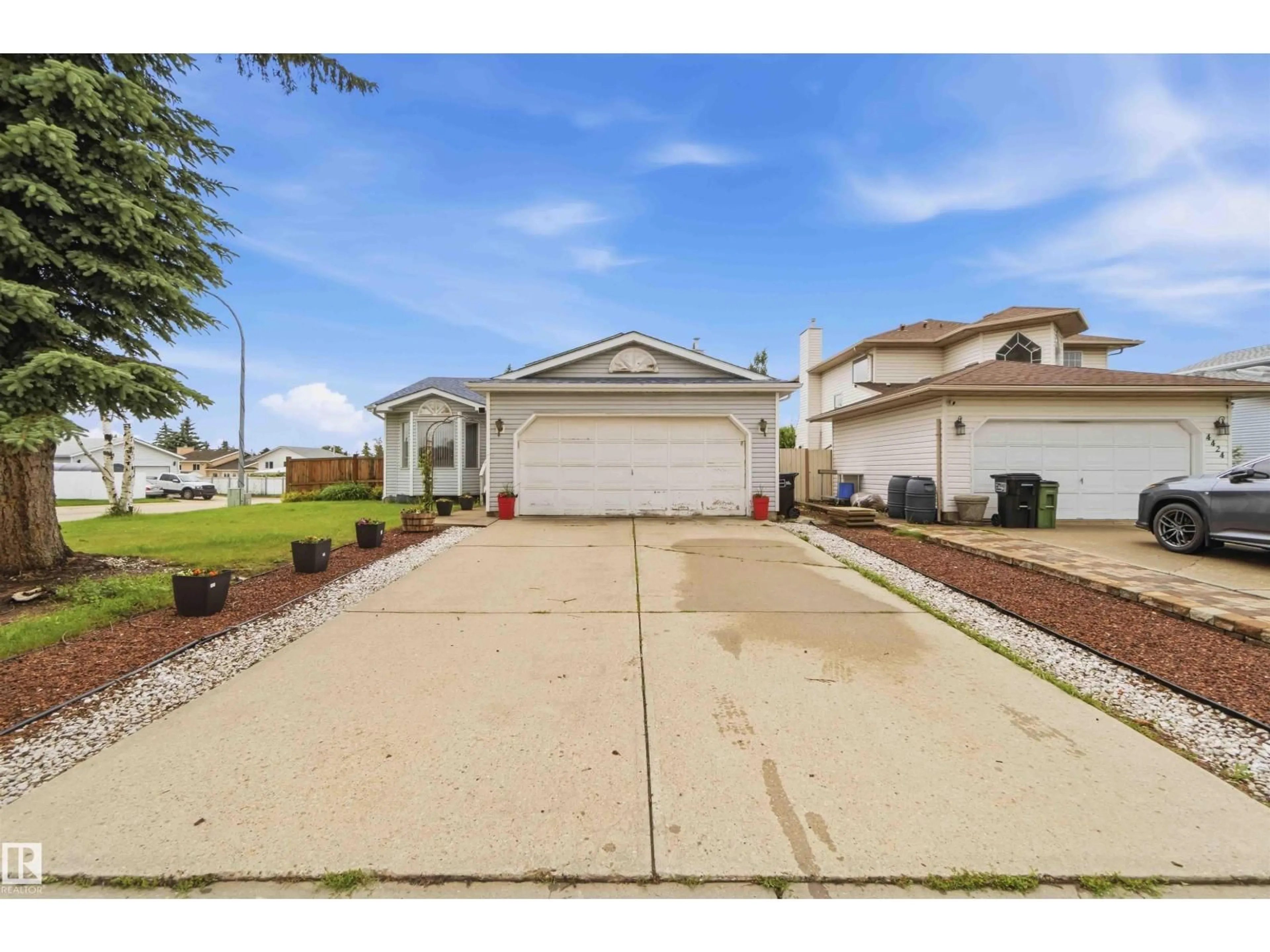 Home with vinyl exterior material, street for 4428 11A AV, Edmonton Alberta T6L6M4