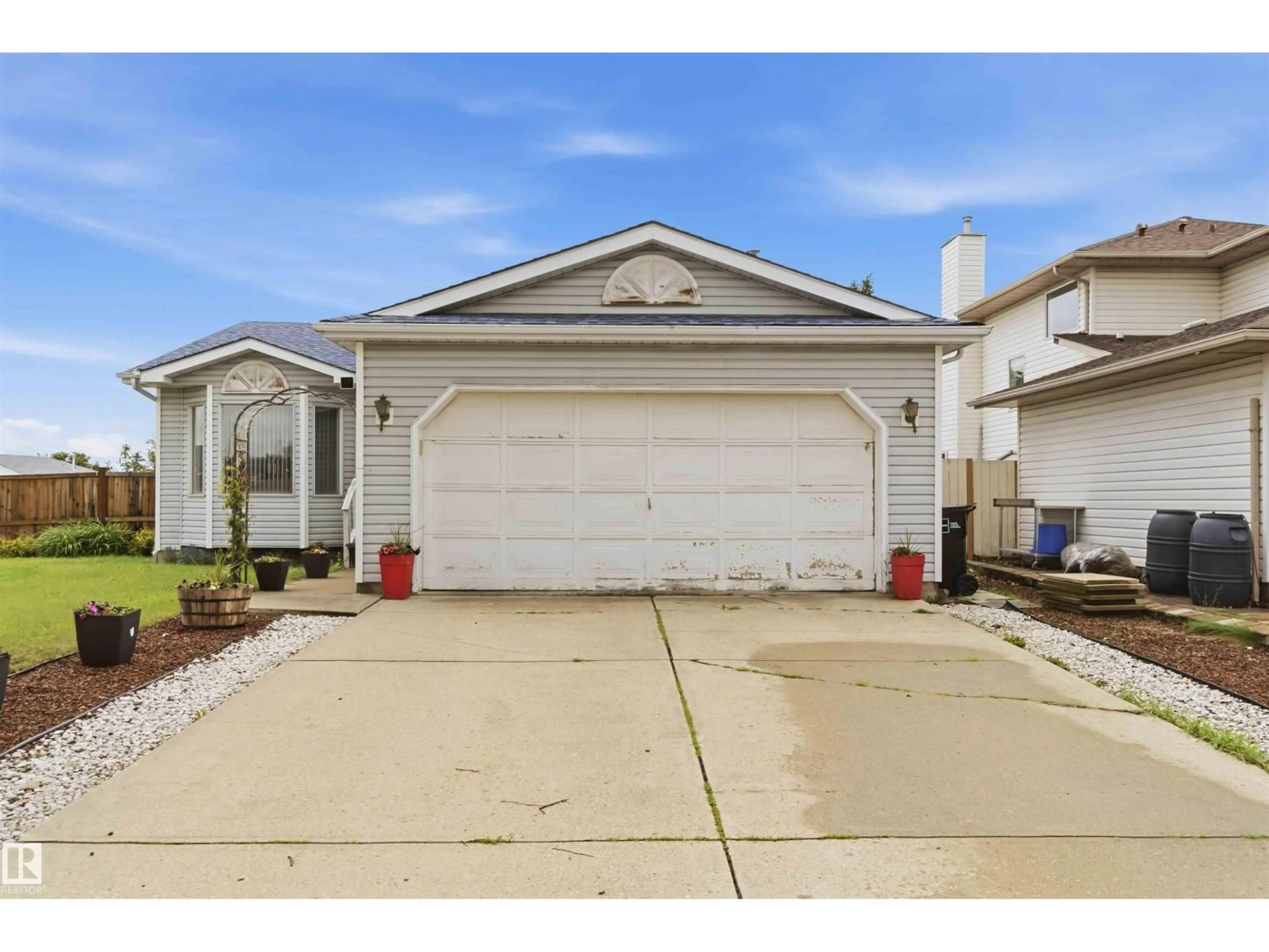Home with vinyl exterior material, street for 4428 11A AV, Edmonton Alberta T6L6M4