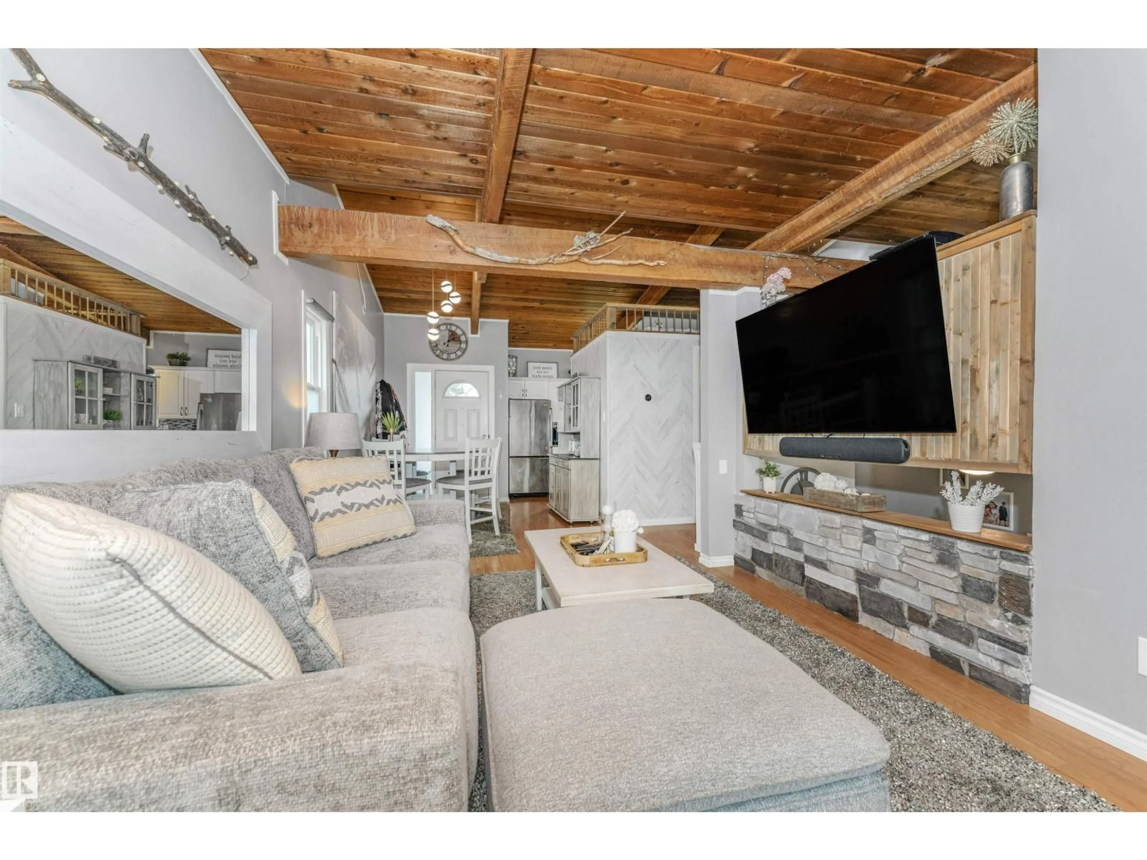 Living room with furniture, wood/laminate floor for NW - 35 NORTHWOODS VG, Edmonton Alberta T5X1T2