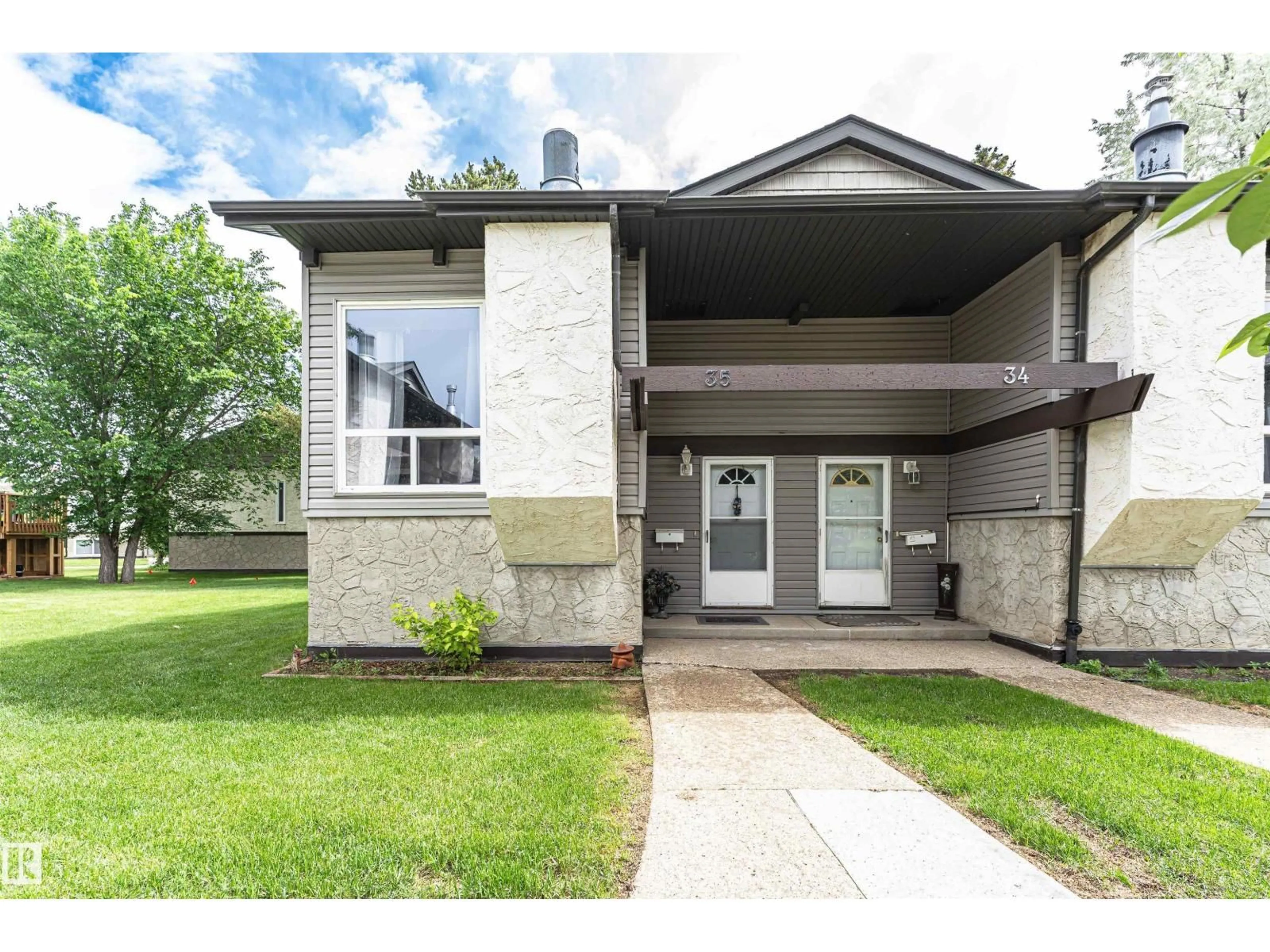 Home with brick exterior material, street for NW - 35 NORTHWOODS VG, Edmonton Alberta T5X1T2