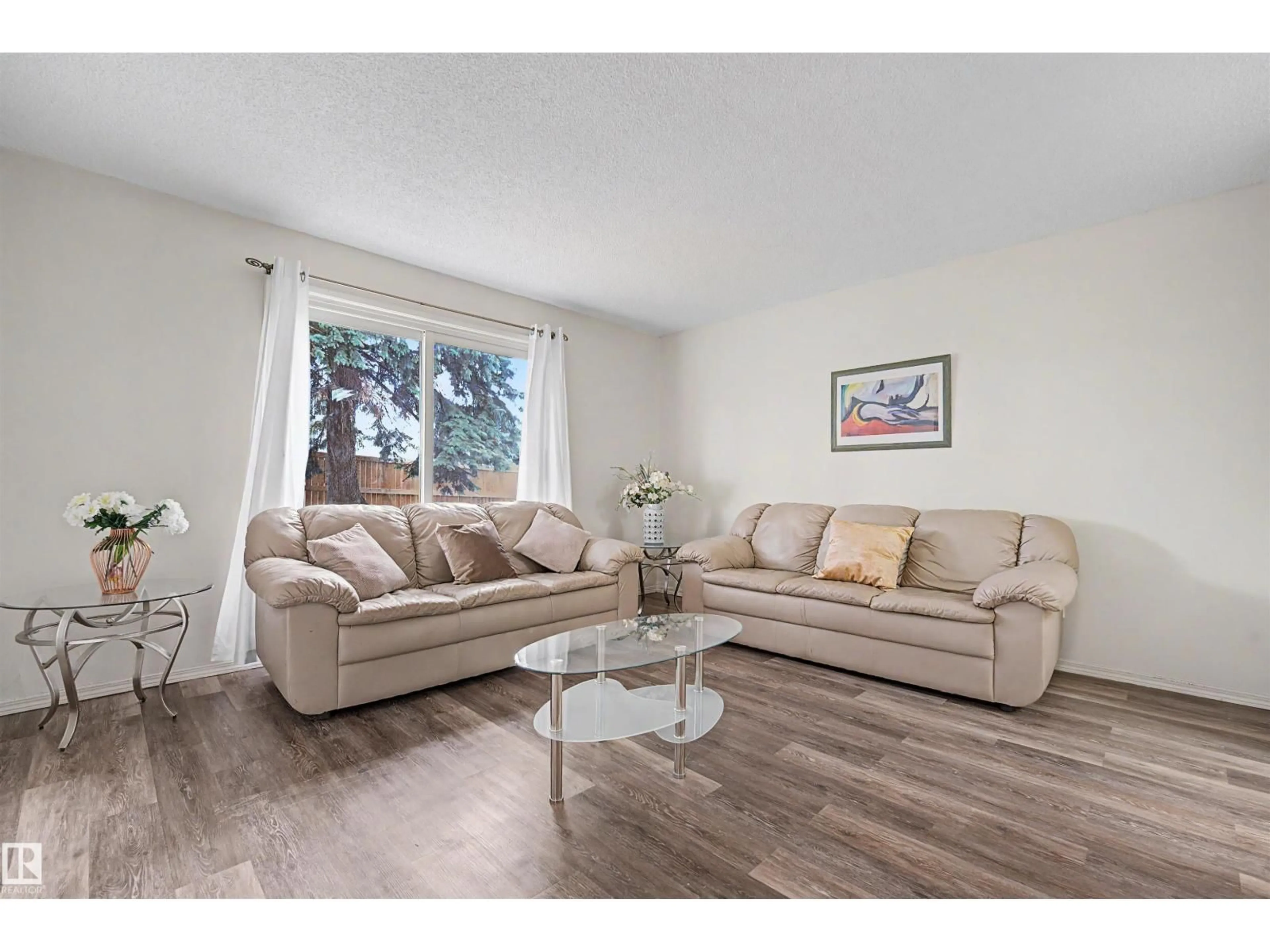 Living room with furniture, wood/laminate floor for 198 - 11421 34 ST, Edmonton Alberta T5W5J7