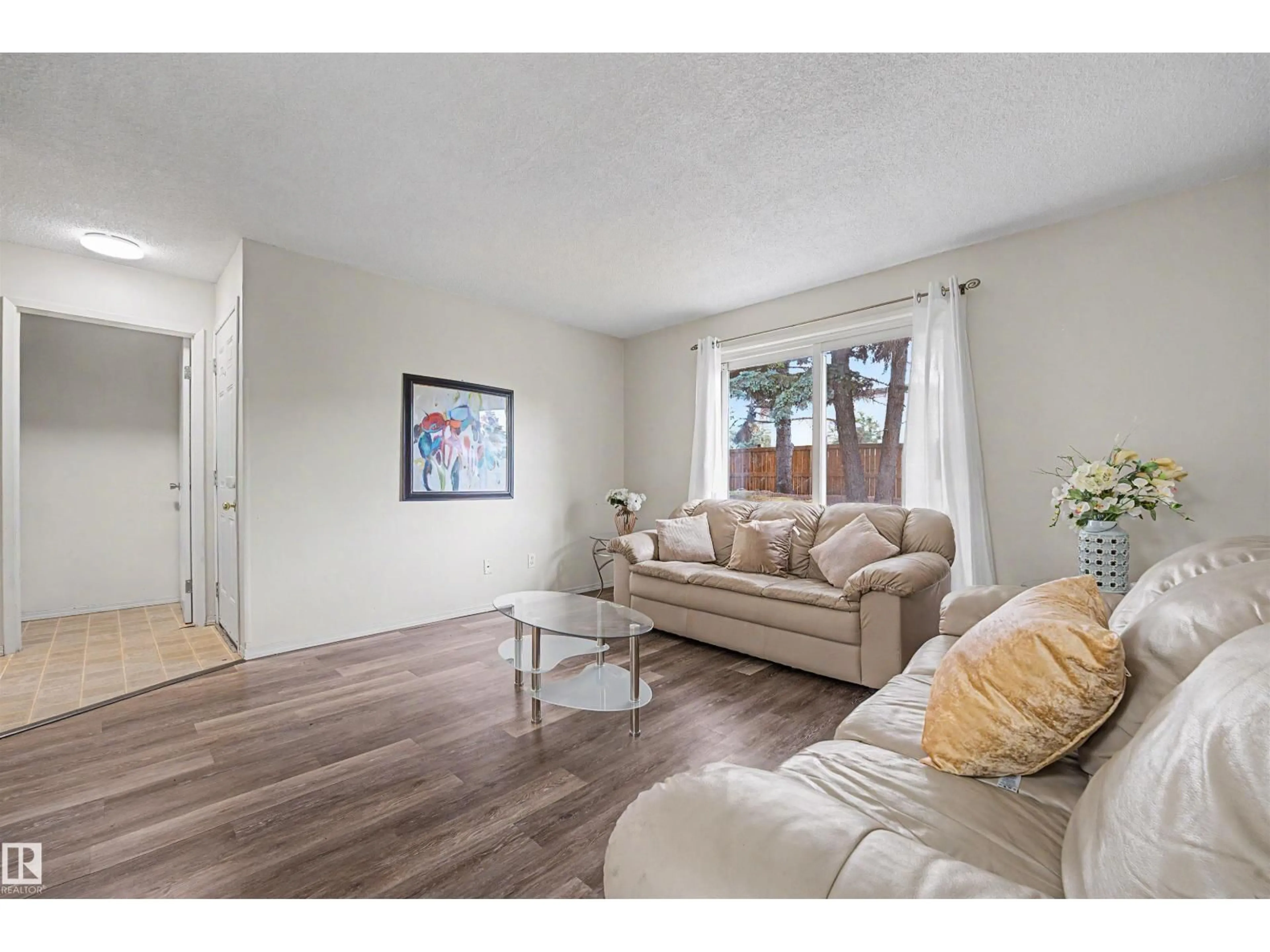 Living room with furniture, wood/laminate floor for 198 - 11421 34 ST, Edmonton Alberta T5W5J7