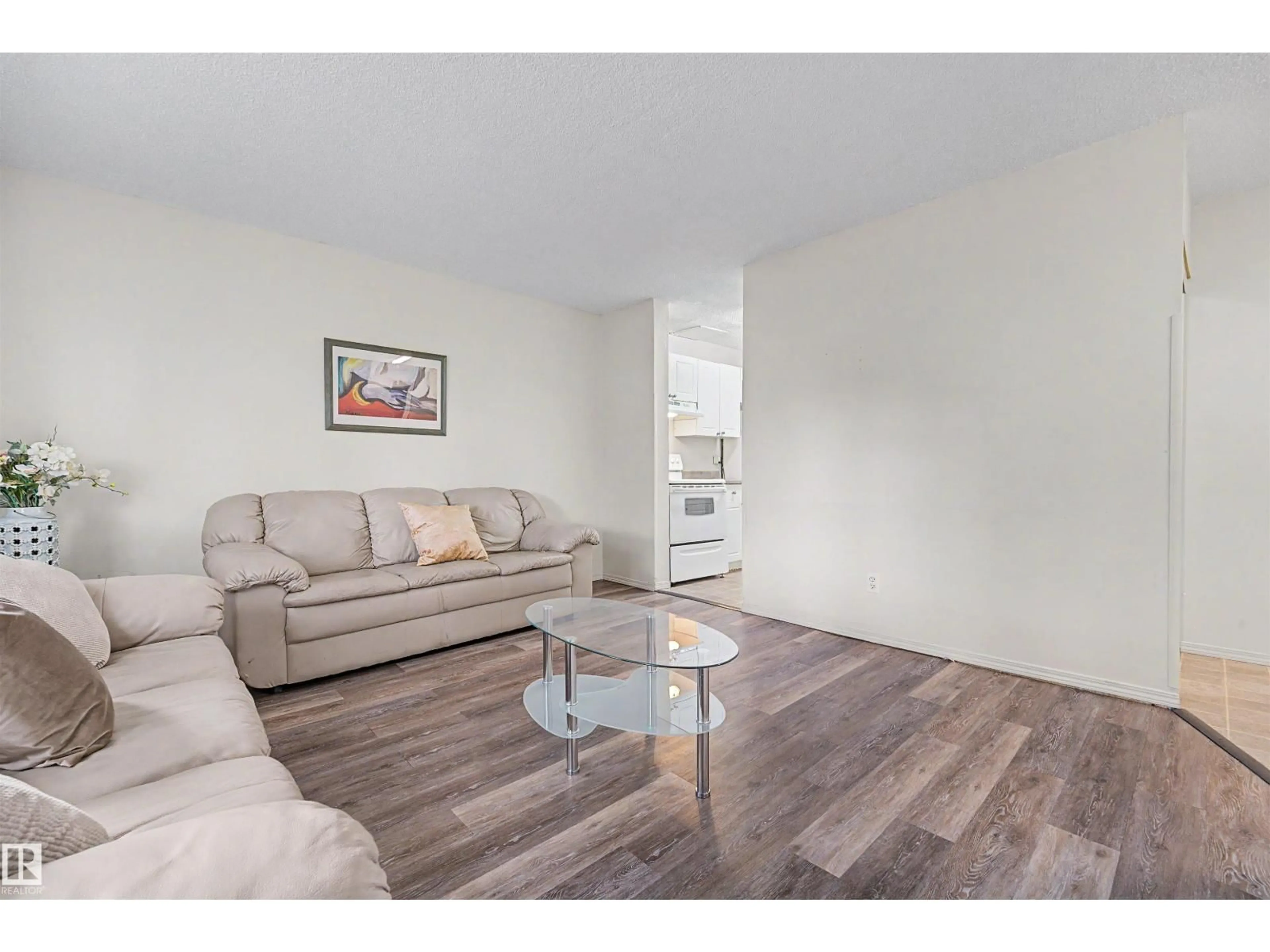 Living room with furniture, wood/laminate floor for 198 - 11421 34 ST, Edmonton Alberta T5W5J7