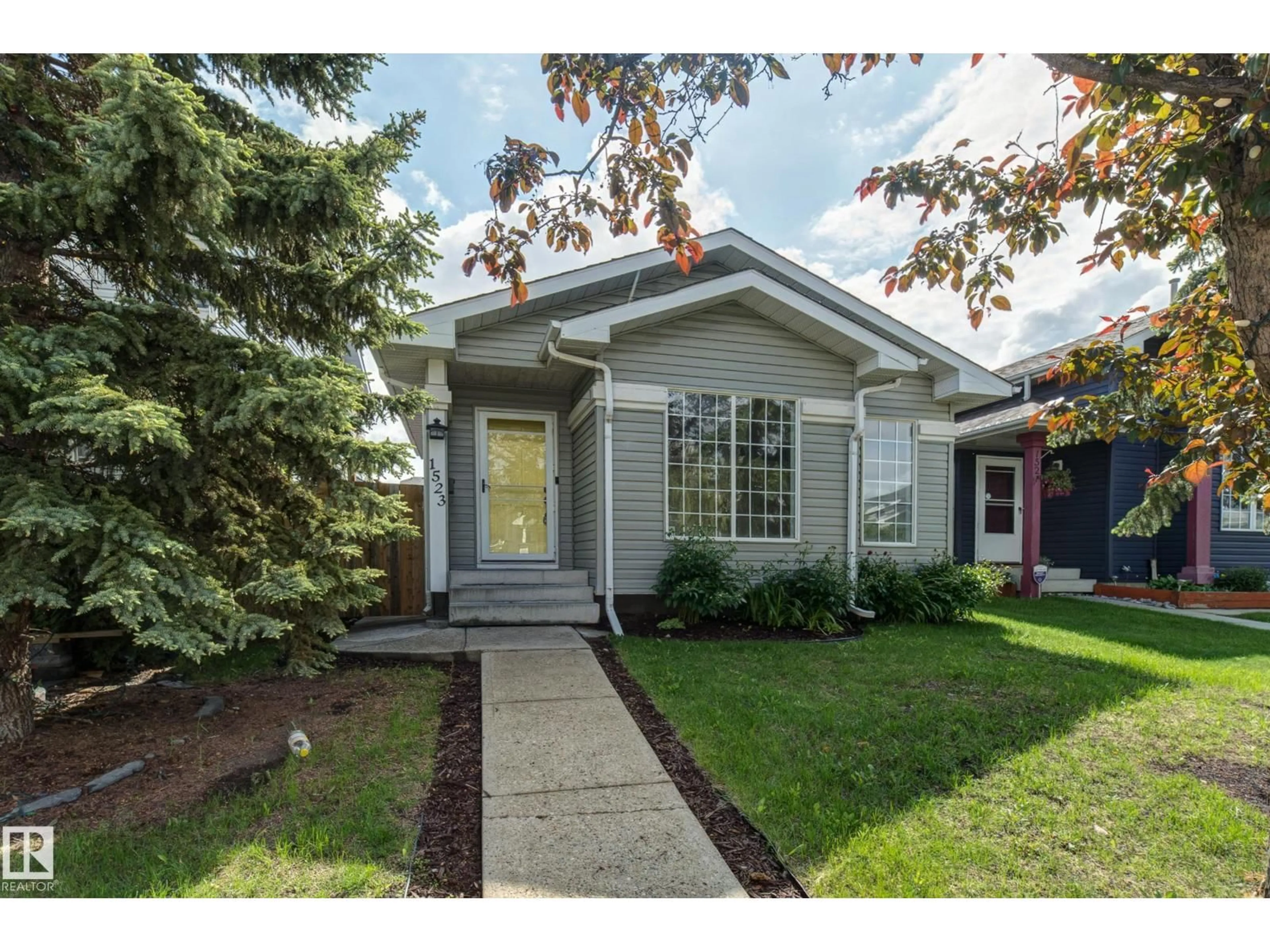 Home with vinyl exterior material, street for 1523 JARVIS CR, Edmonton Alberta T6L6S4