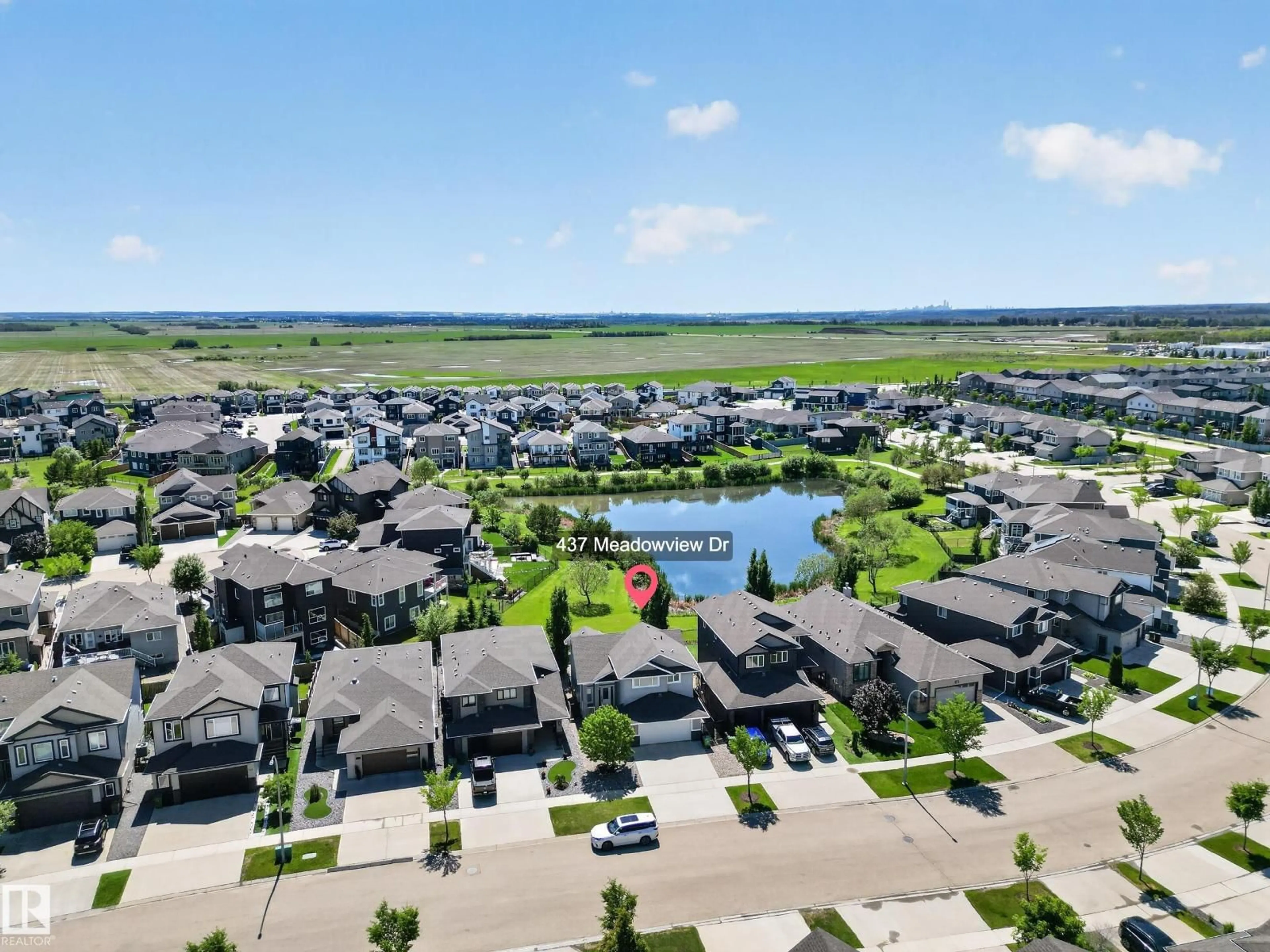 A pic from outside/outdoor area/front of a property/back of a property/a pic from drone, water/lake/river/ocean view for 437 MEADOWVIEW DR, Fort Saskatchewan Alberta T8L0N9