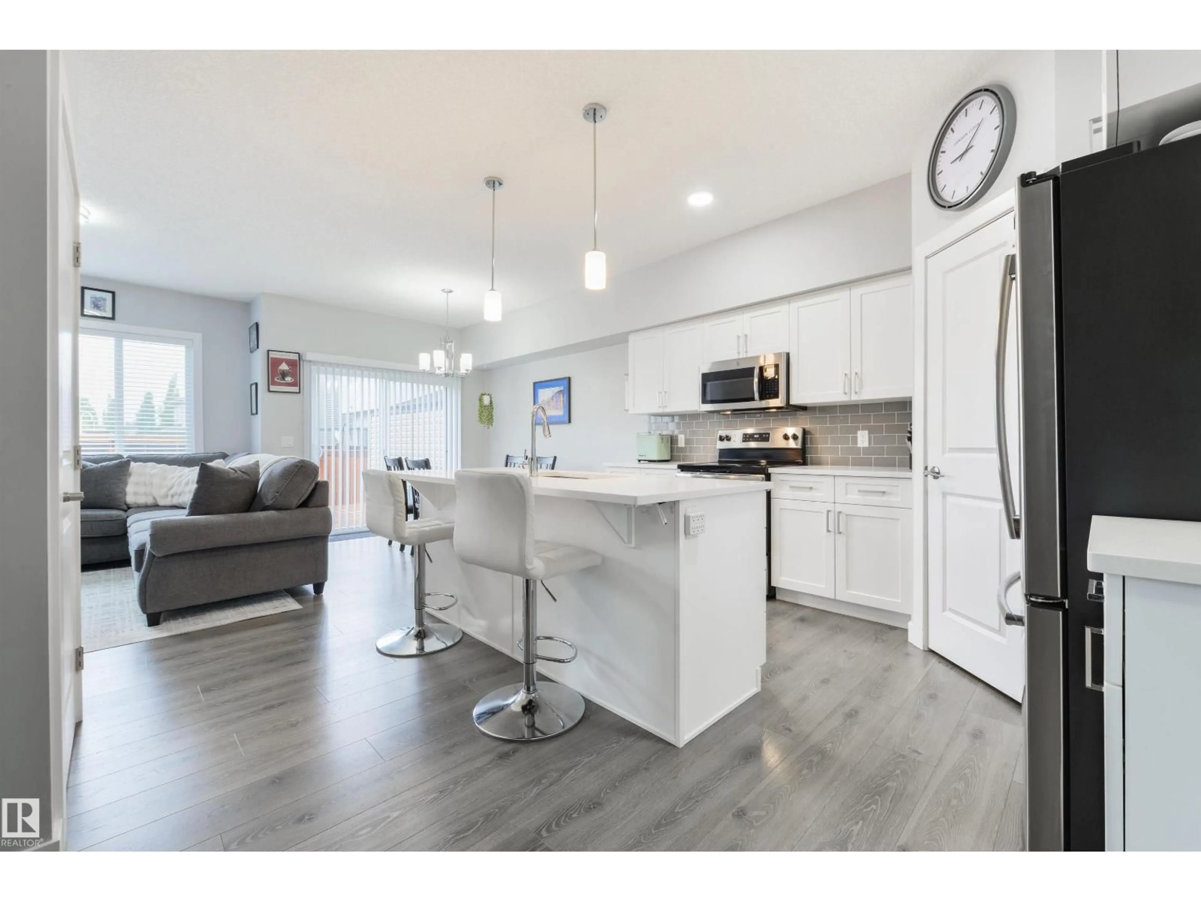 Open concept kitchen, wood/laminate floor for 8 HALLADAY BV, Spruce Grove Alberta T7X0P5