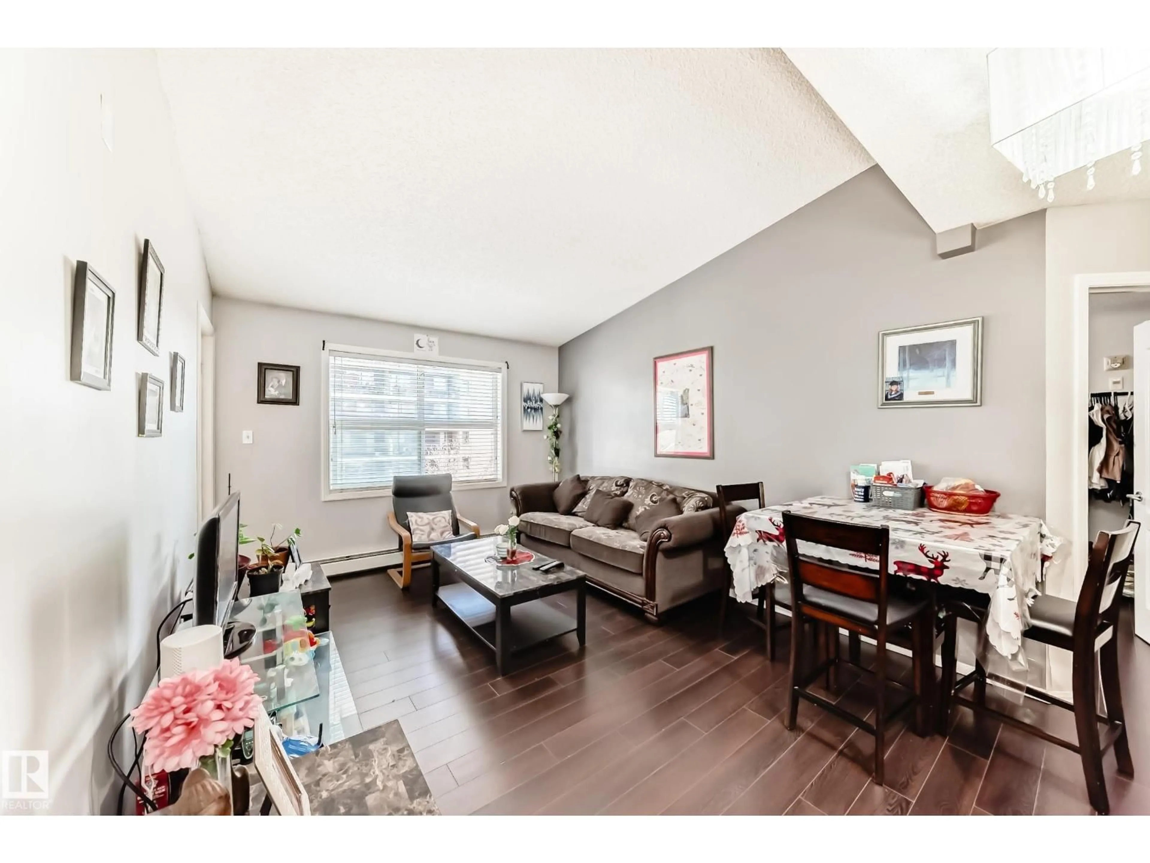 Living room with furniture, wood/laminate floor for 422 - 12838 65 ST, Edmonton Alberta T5A5H3