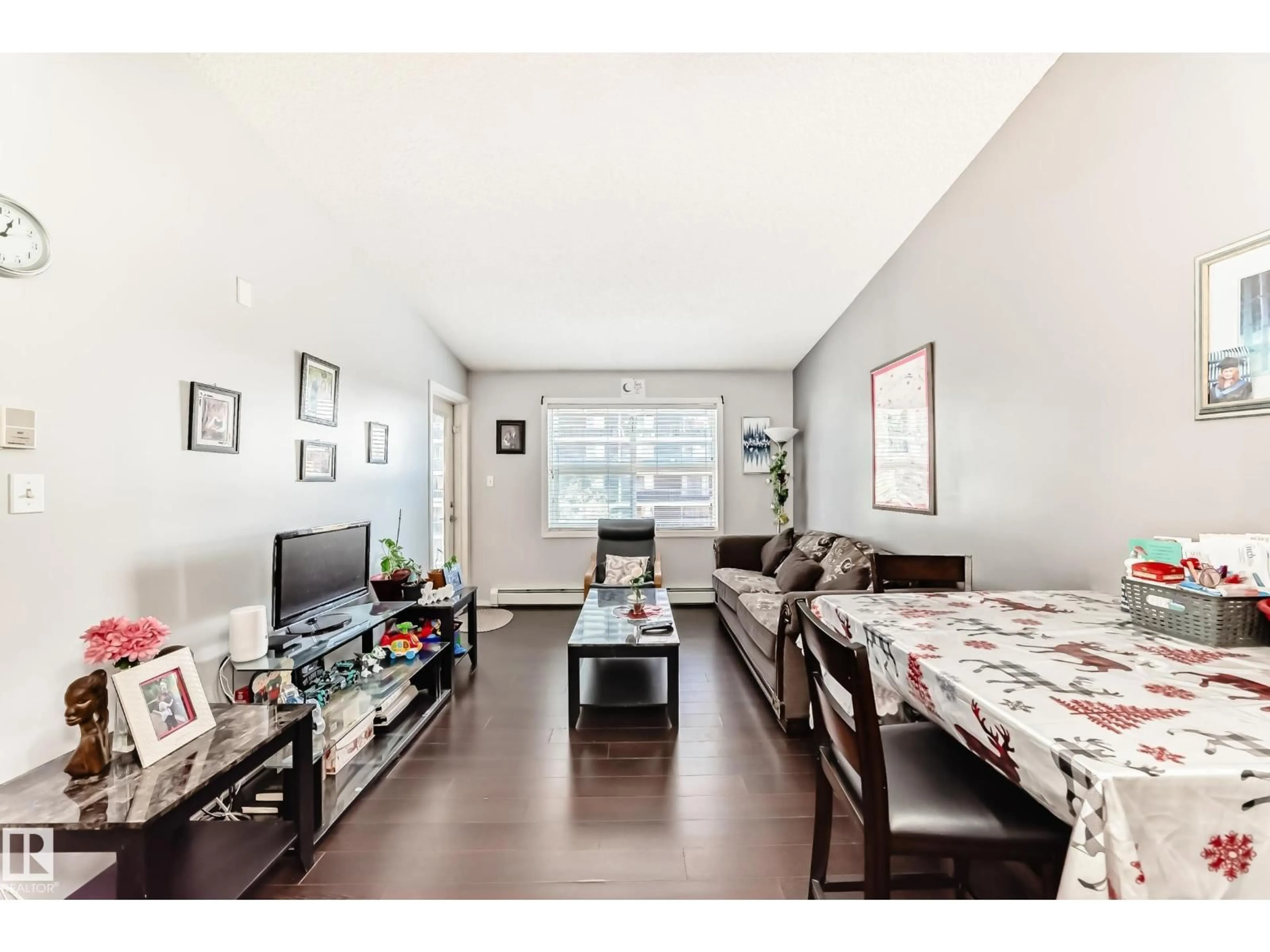 Living room with furniture, wood/laminate floor for 422 - 12838 65 ST, Edmonton Alberta T5A5H3