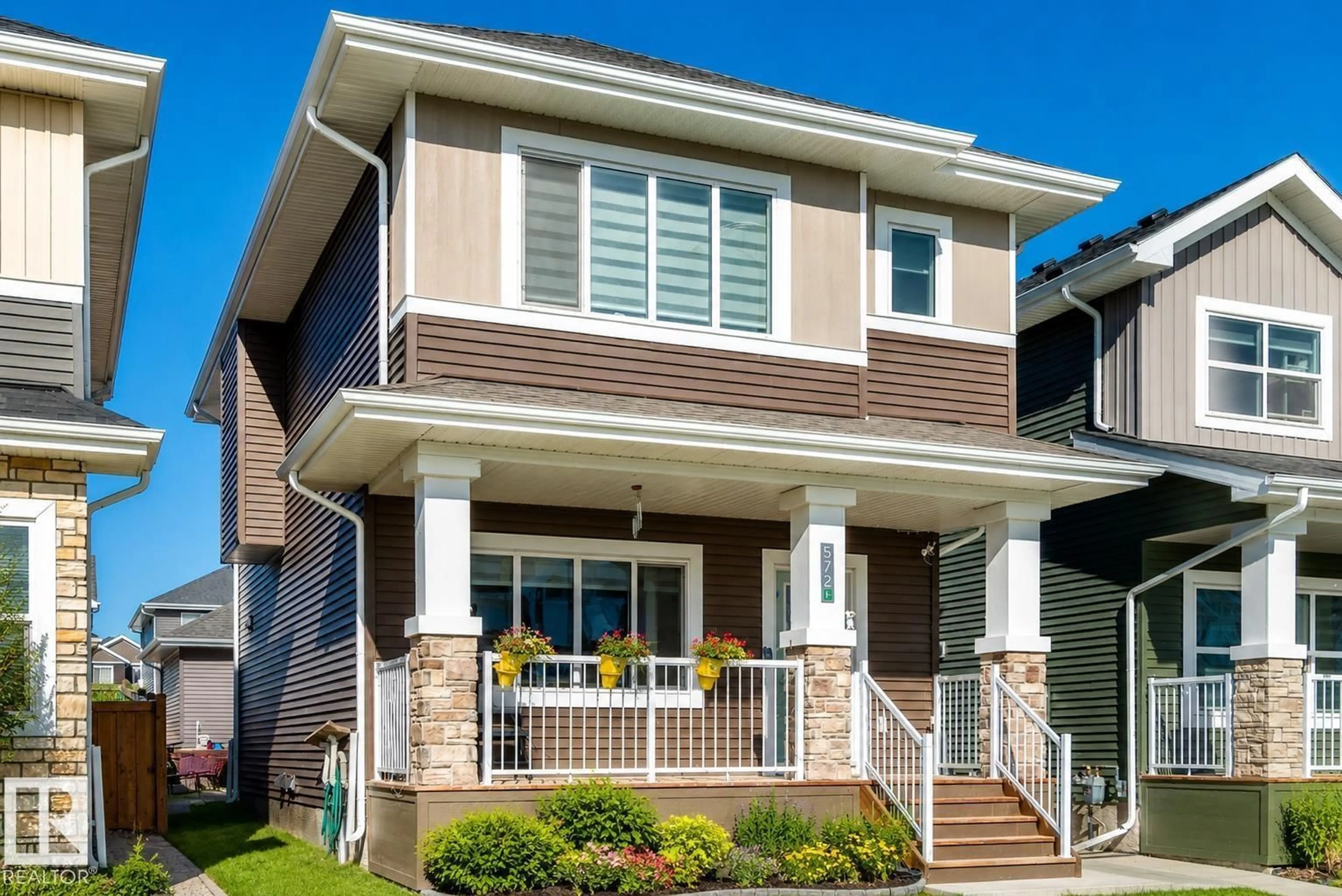 Home with vinyl exterior material, street for 572 GLENRIDDING RAVINE DR, Edmonton Alberta T6W4P1