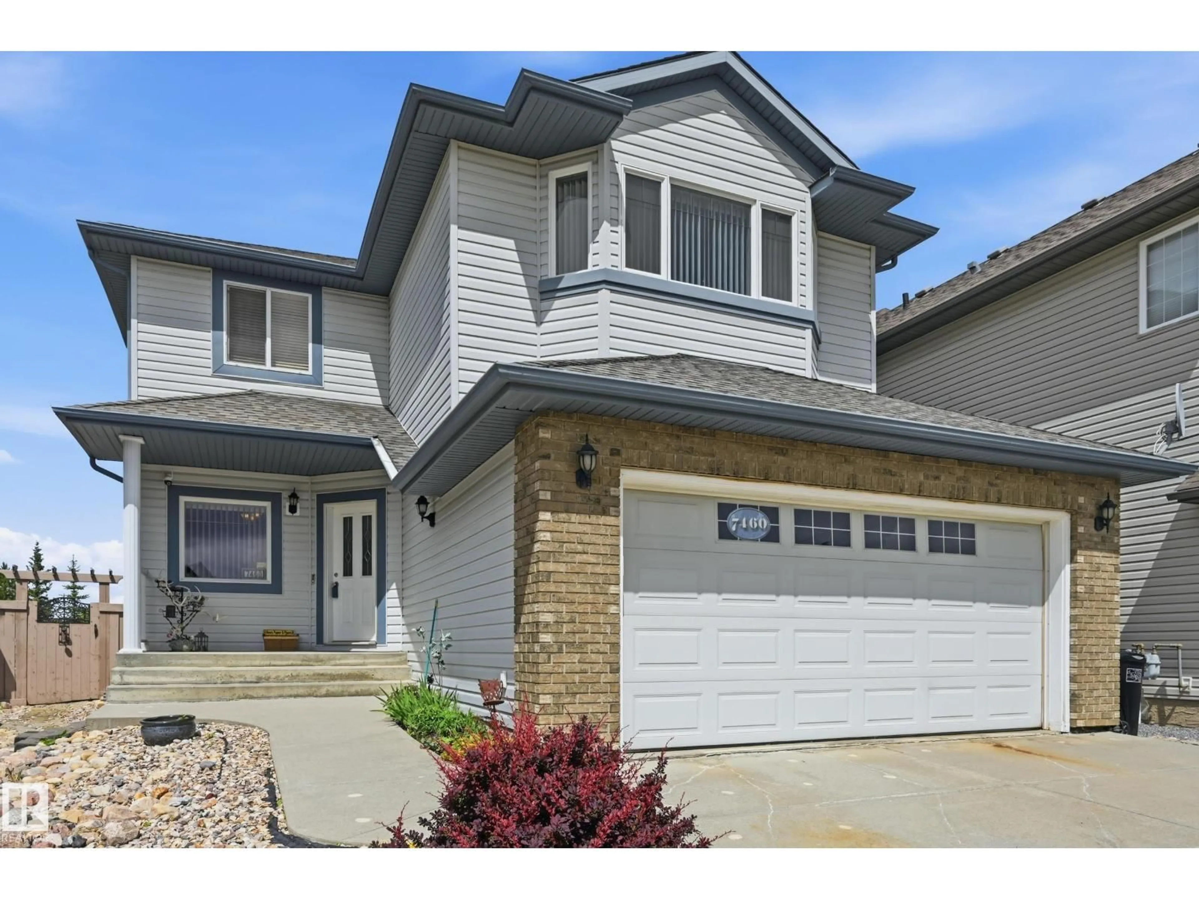 Home with vinyl exterior material, street for NW - 7460 SINGER LD, Edmonton Alberta T6R3S3