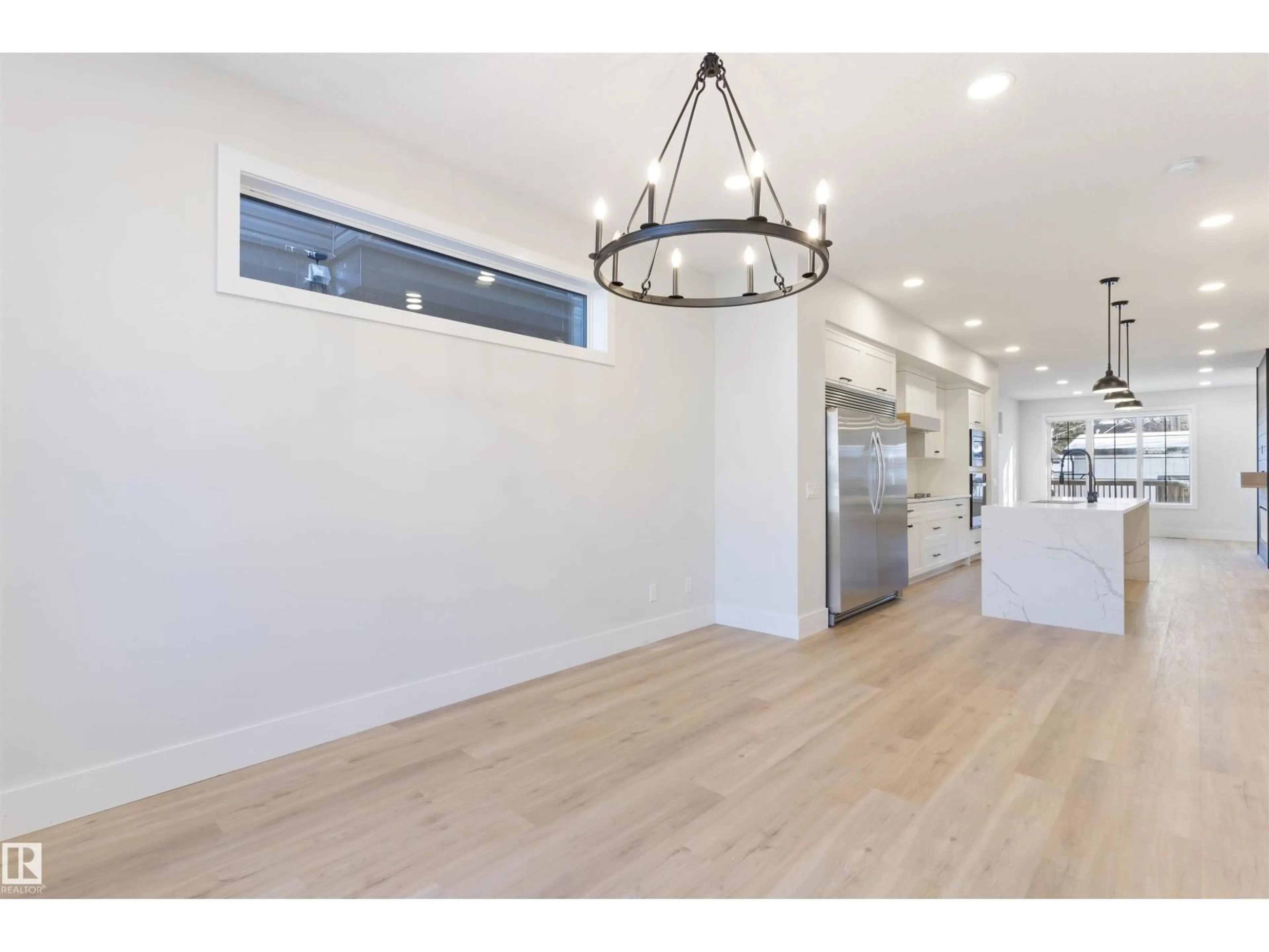 Open concept kitchen, wood/laminate floor for NW - 10419 136 ST, Edmonton Alberta T5N2E7