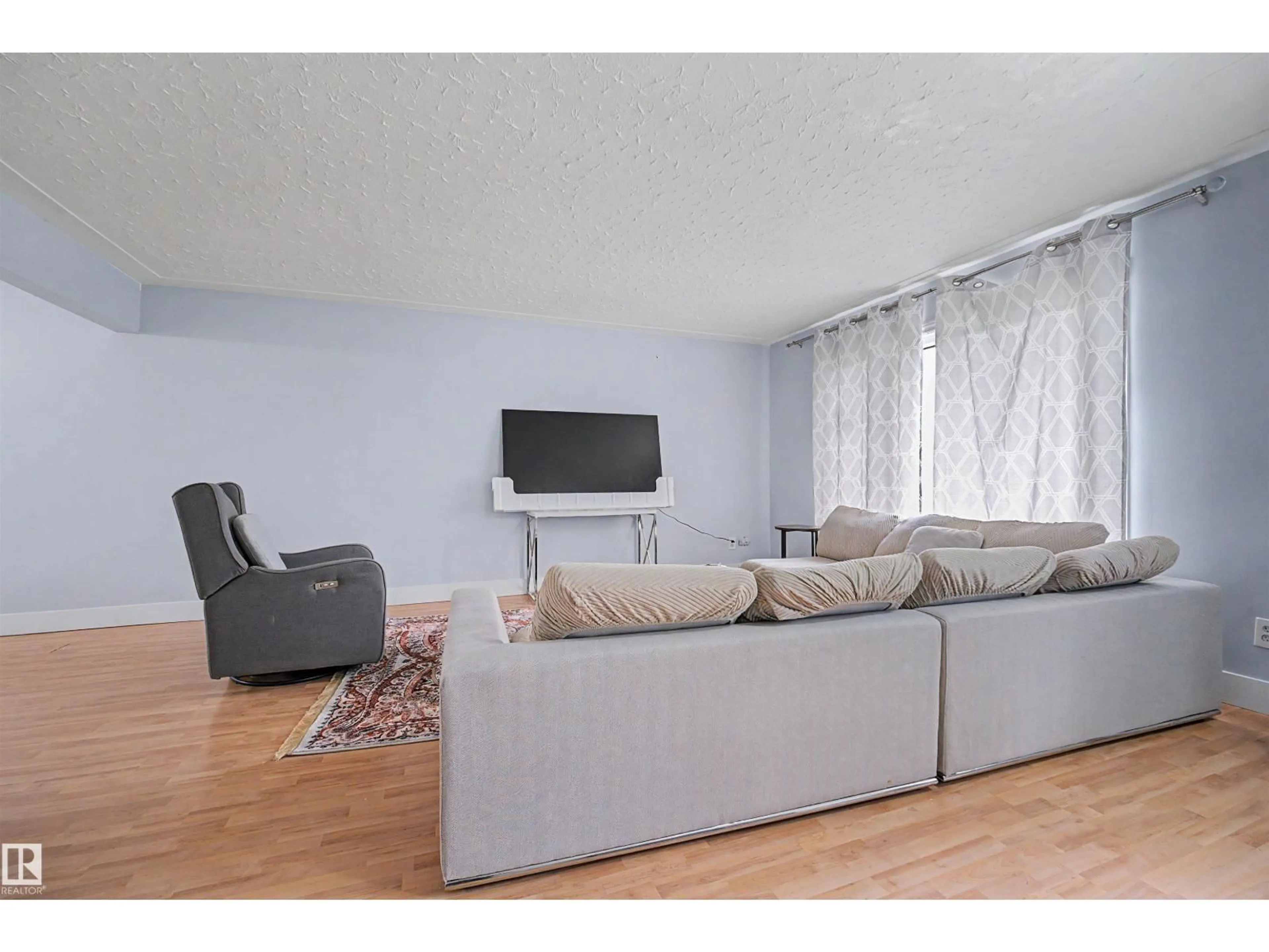 Living room with furniture, wood/laminate floor for NW - 12707 87 ST, Edmonton Alberta T5E3C8