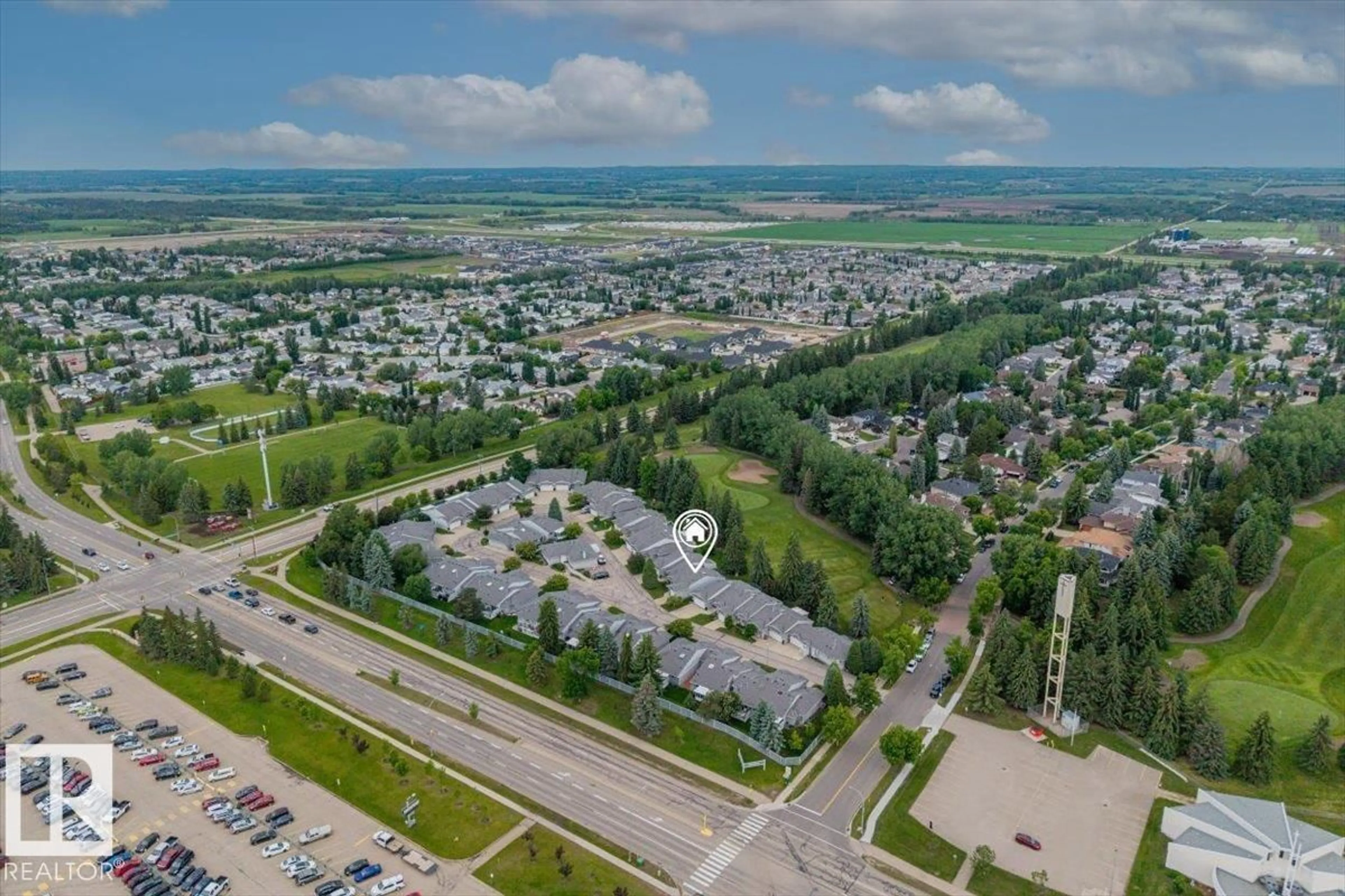 A pic from outside/outdoor area/front of a property/back of a property/a pic from drone, mountain view for 2A - 5 FIELDSTONE DR, Spruce Grove Alberta T7X3E7