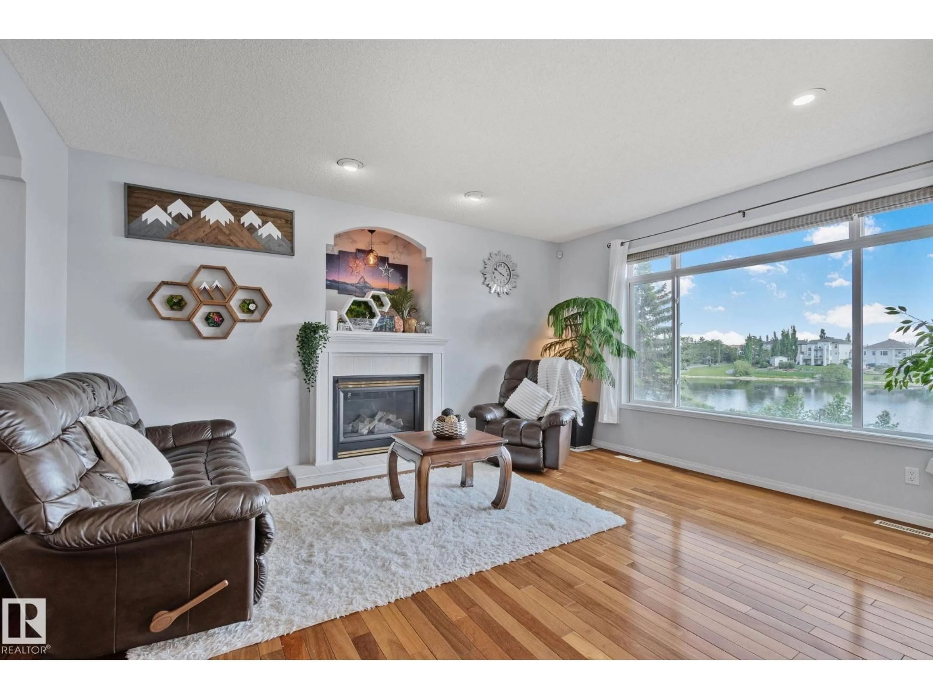 Living room with furniture, wood/laminate floor for 13411 149 AV, Edmonton Alberta T6V1L1