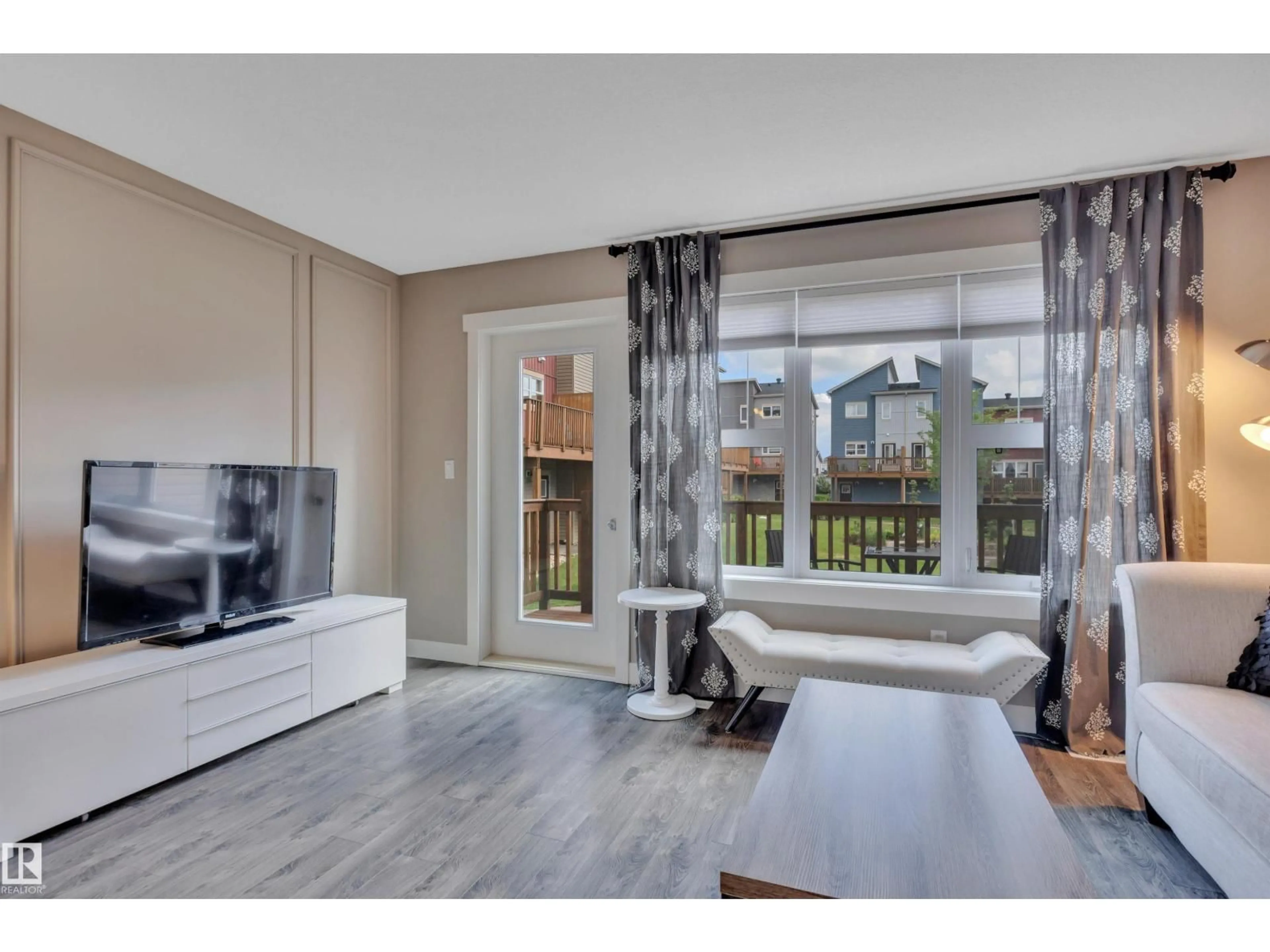 Living room with furniture, wood/laminate floor for #209 - 401 SOUTHFORK DR, Leduc Alberta T9E0X1