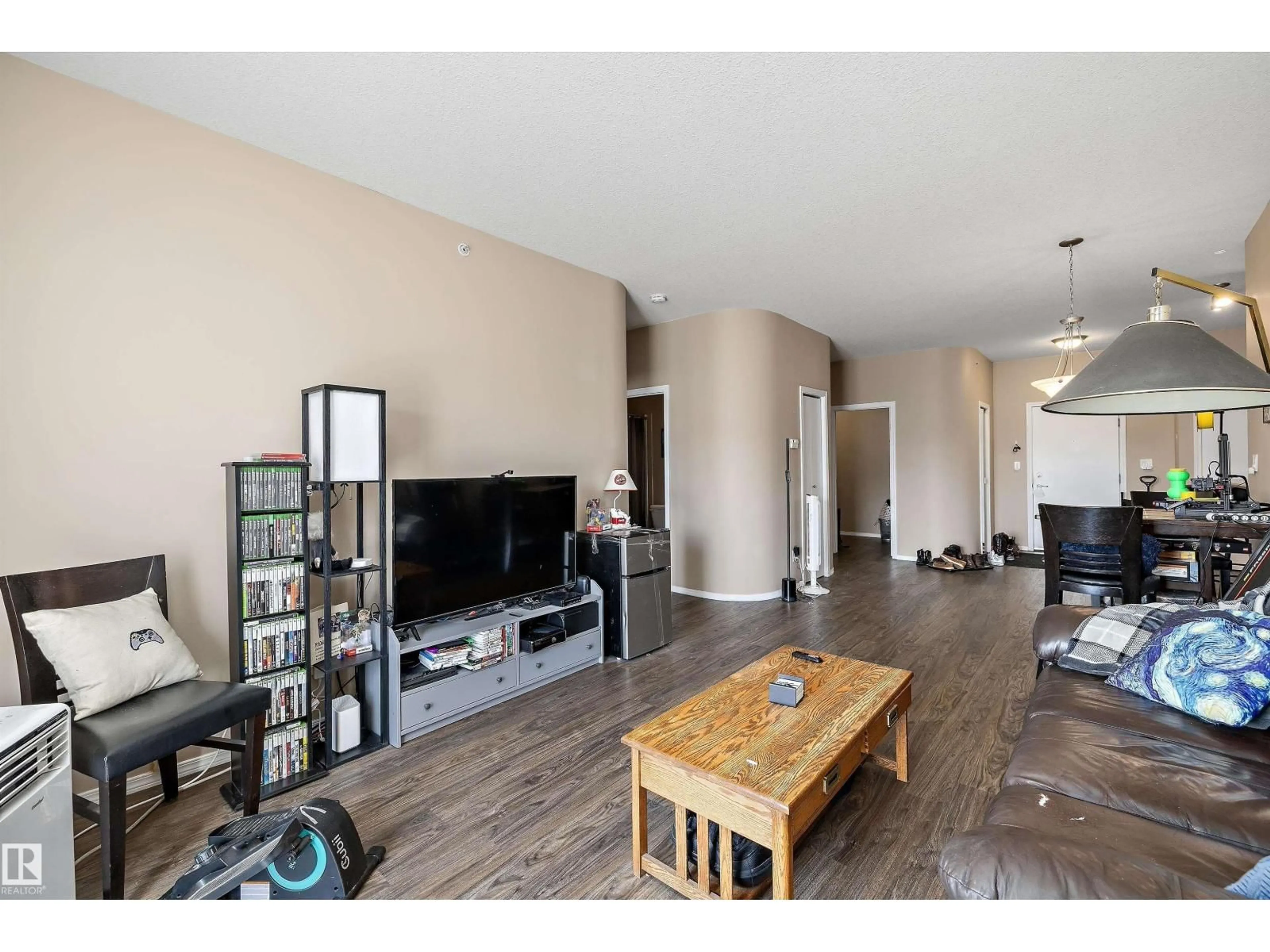 Living room with furniture, wood/laminate floor for #417 - 4316 139 AV, Edmonton Alberta T5Y0C1