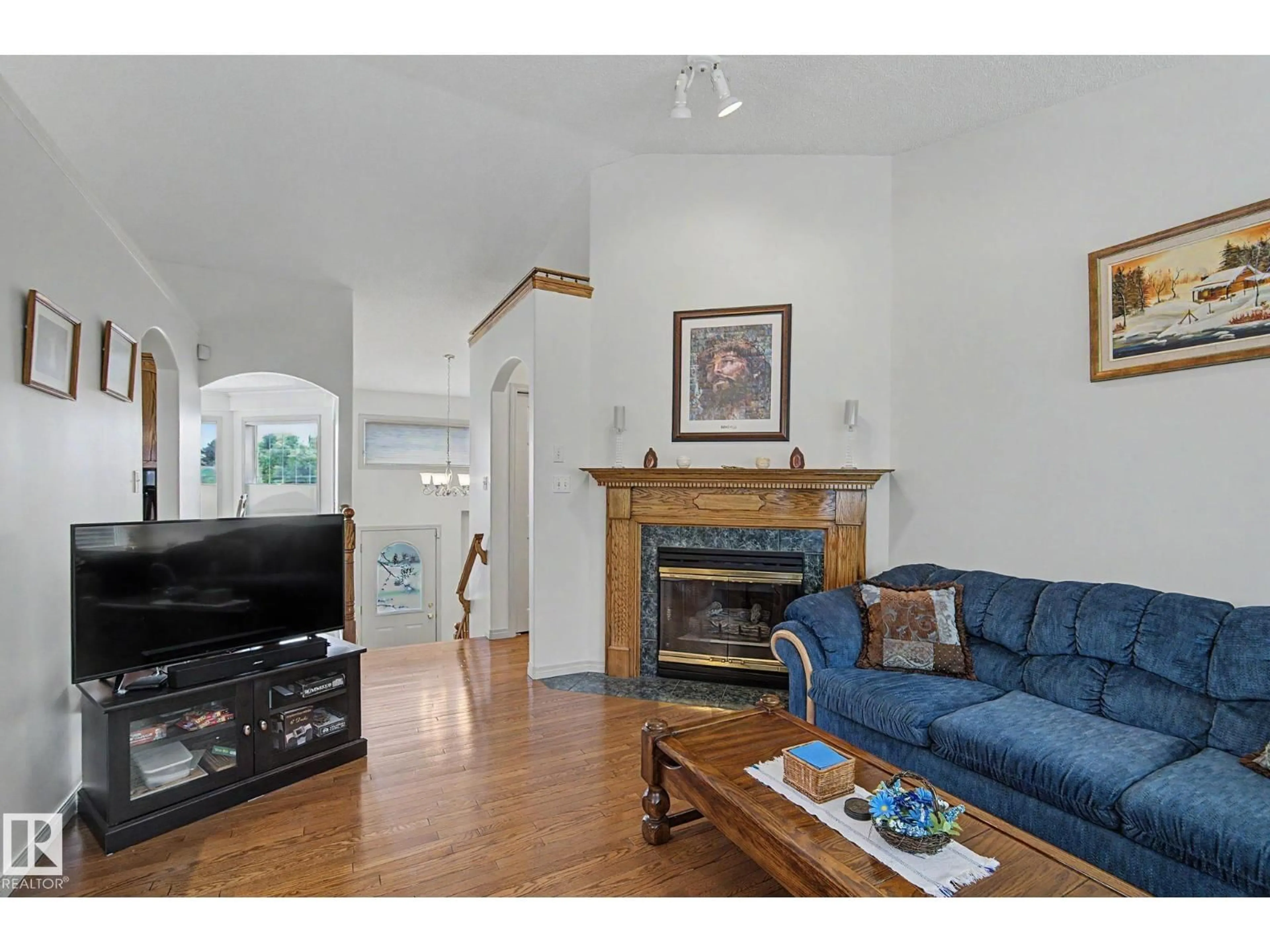 Living room with furniture, wood/laminate floor for 6 CHANCERY WY, Sherwood Park Alberta T8H1Y3