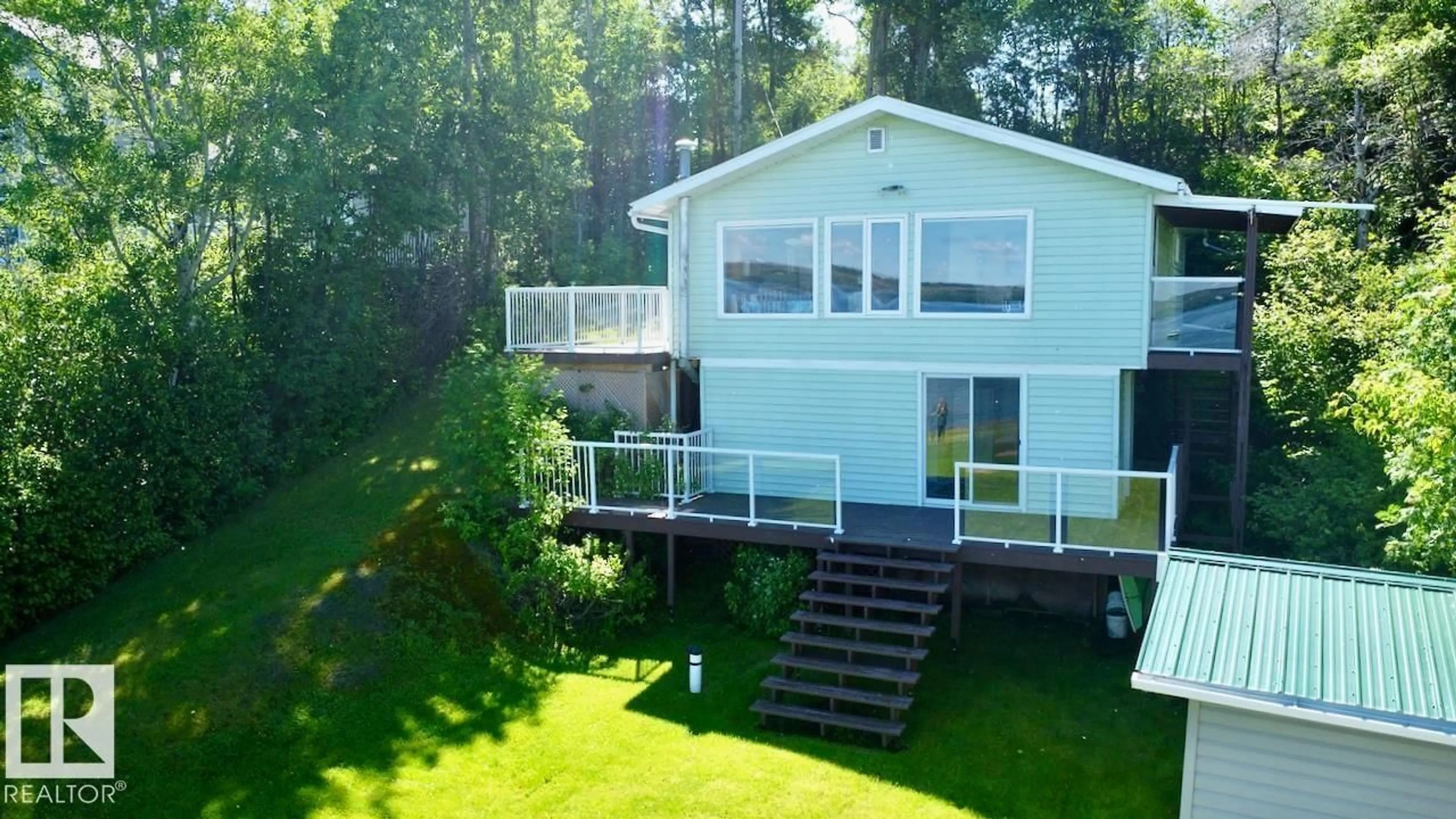 A pic from outside/outdoor area/front of a property/back of a property/a pic from drone, water/lake/river/ocean view for 14 52515 RGE ROAD 52, Rural Parkland County Alberta T0E2B0