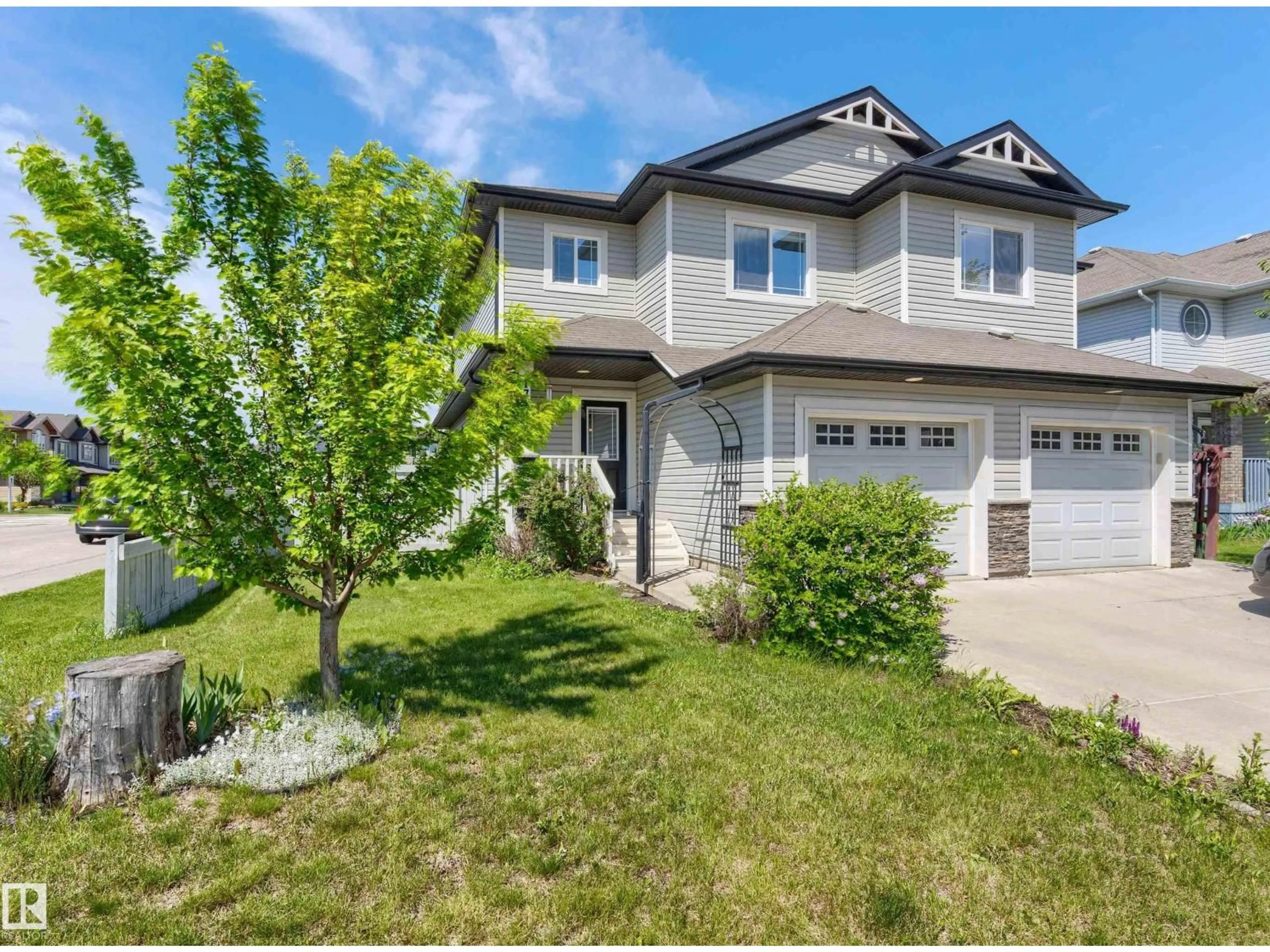 Home with vinyl exterior material, street for 17130 7A AV SW, Edmonton Alberta T6W0M5