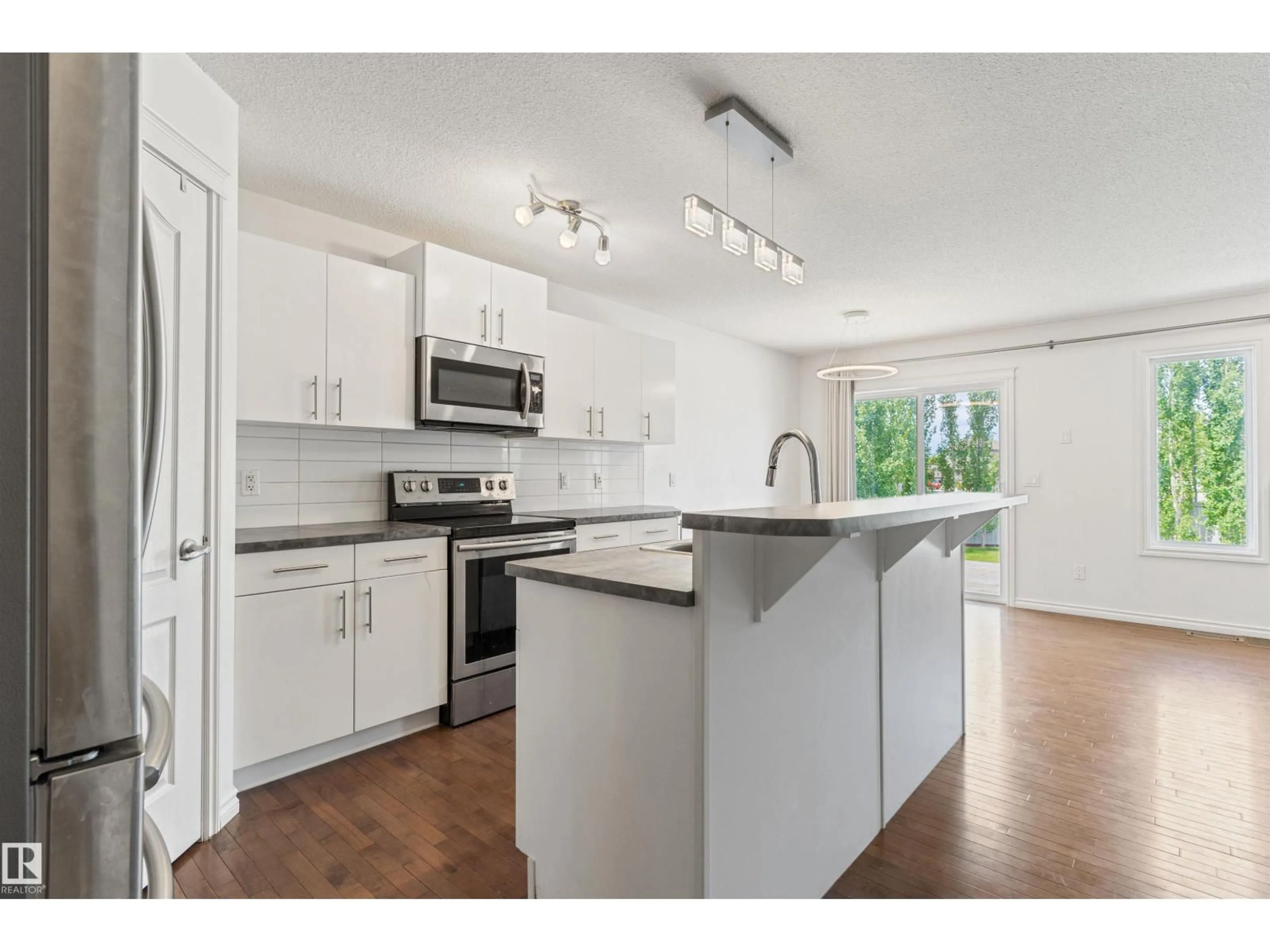 Open concept kitchen, unknown for 17130 7A AV SW, Edmonton Alberta T6W0M5