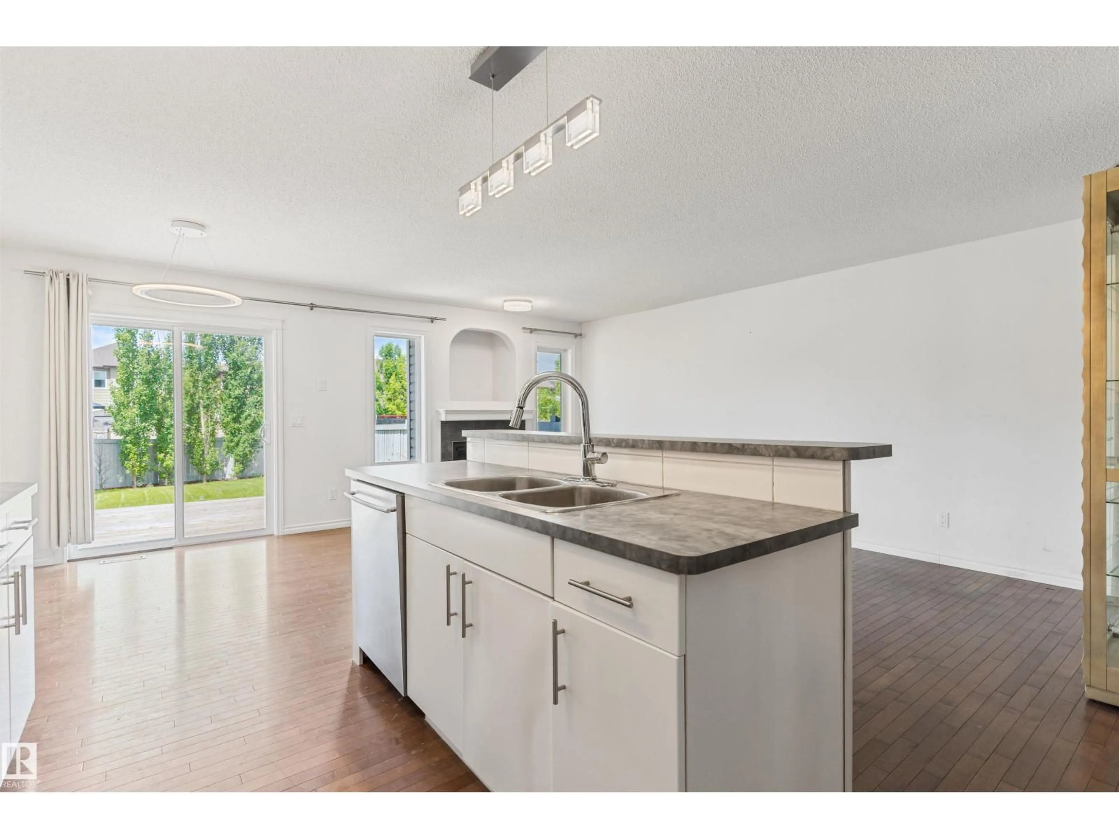 Open concept kitchen, ceramic/tile floor for 17130 7A AV SW, Edmonton Alberta T6W0M5