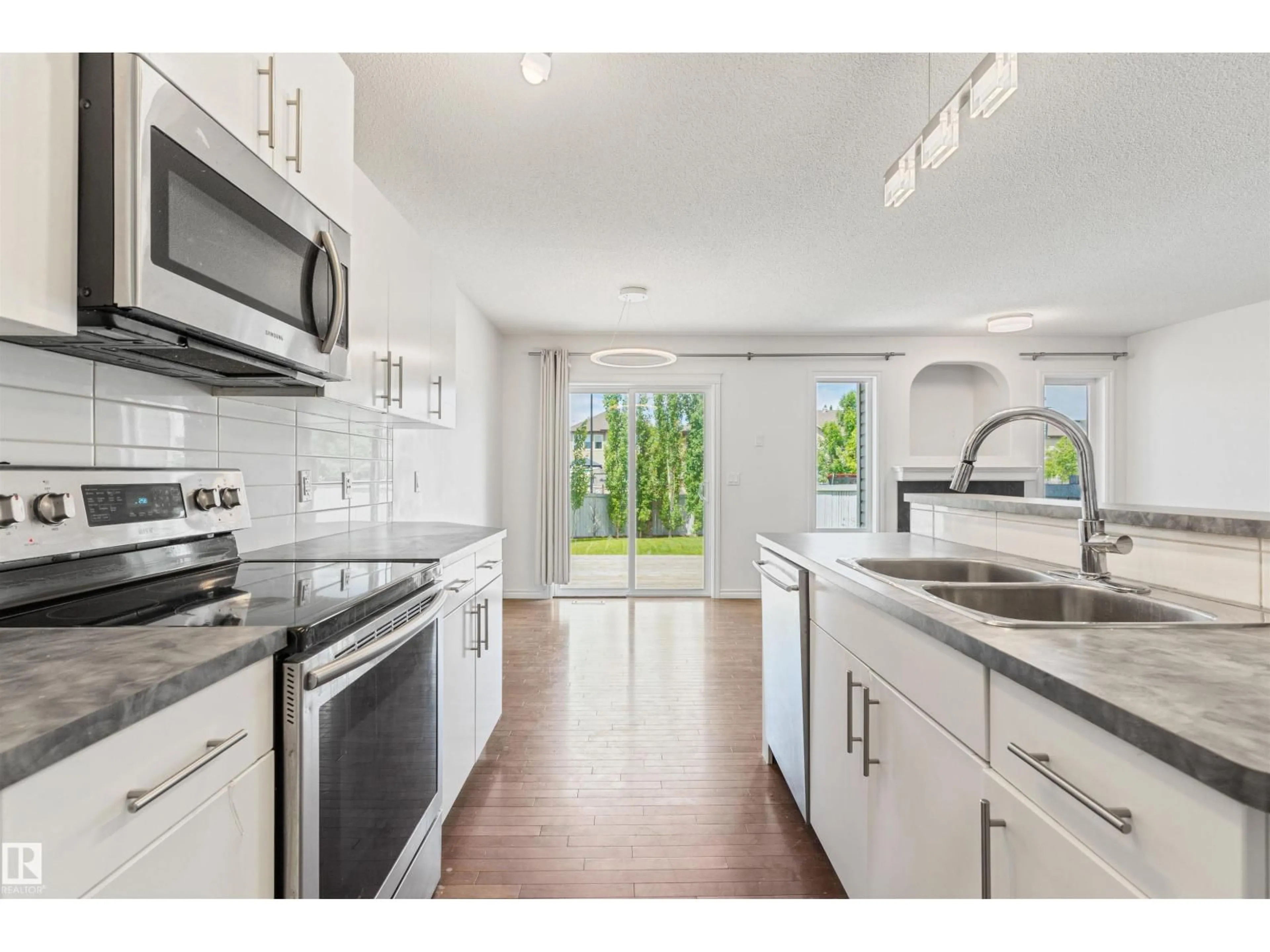 Open concept kitchen, ceramic/tile floor for 17130 7A AV SW, Edmonton Alberta T6W0M5