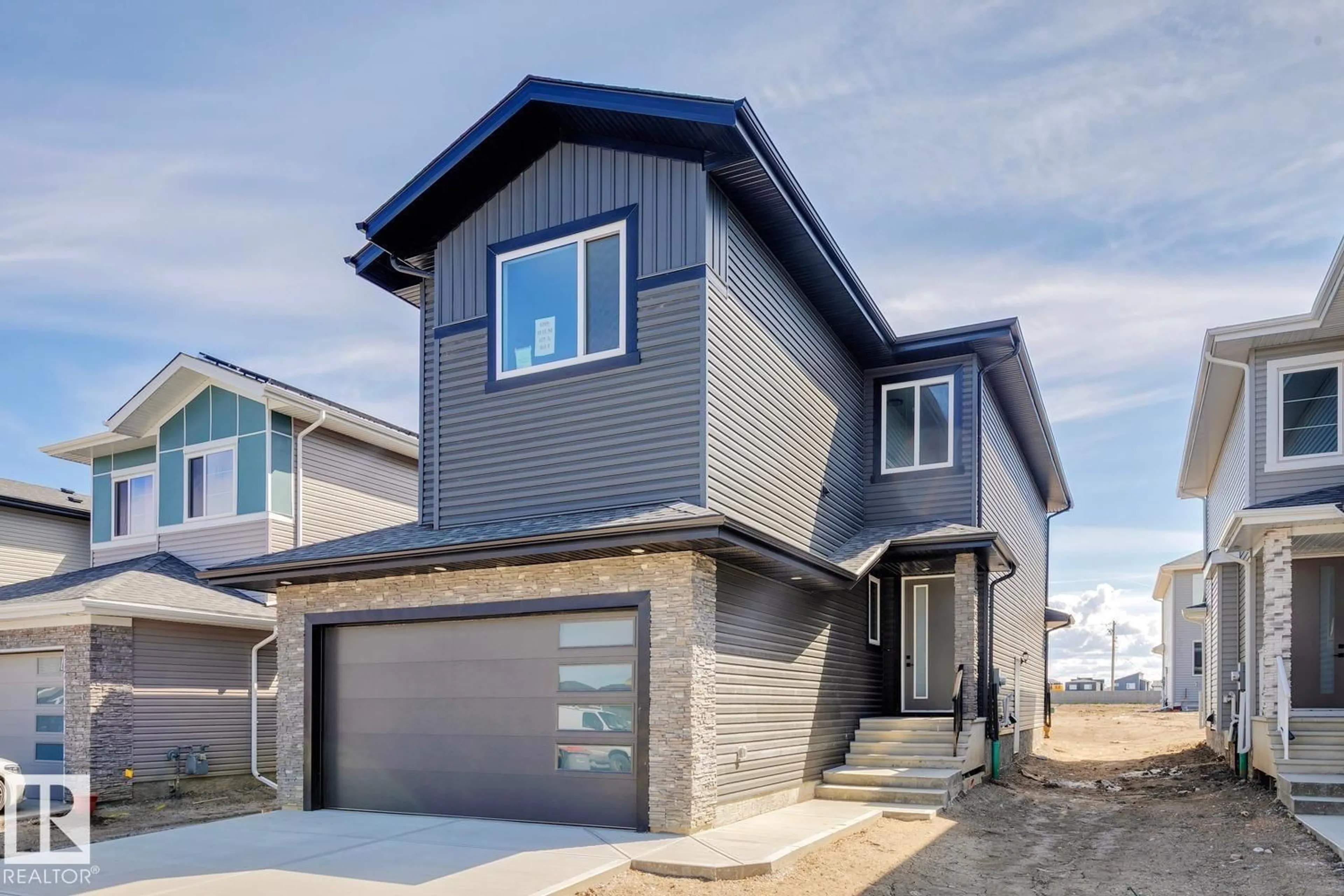 Home with vinyl exterior material, street for NE - 6269 19 ST, Rural Leduc County Alberta T4X3C8