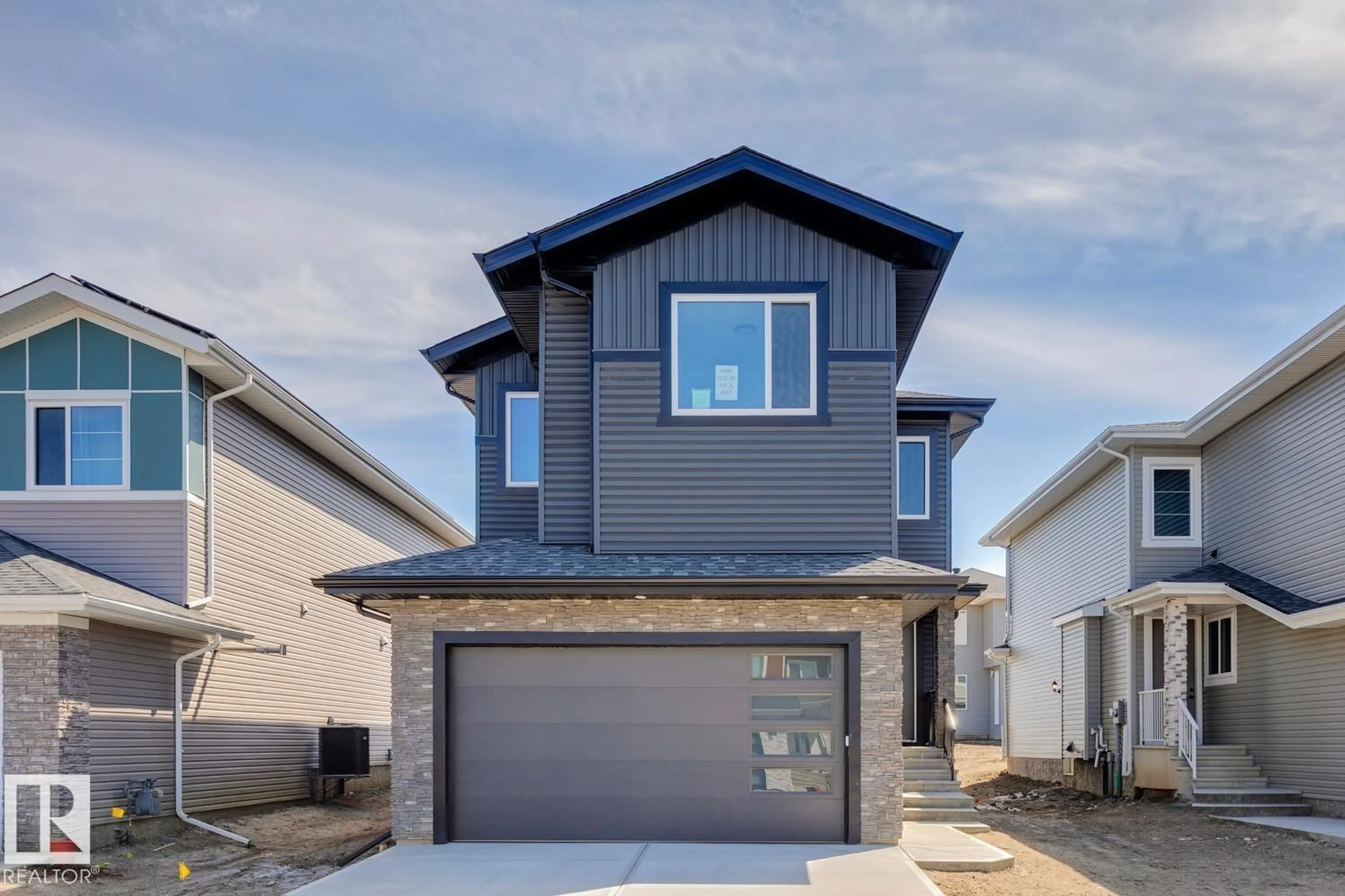 Home with vinyl exterior material, street for NE - 6269 19 ST, Rural Leduc County Alberta T4X3C8
