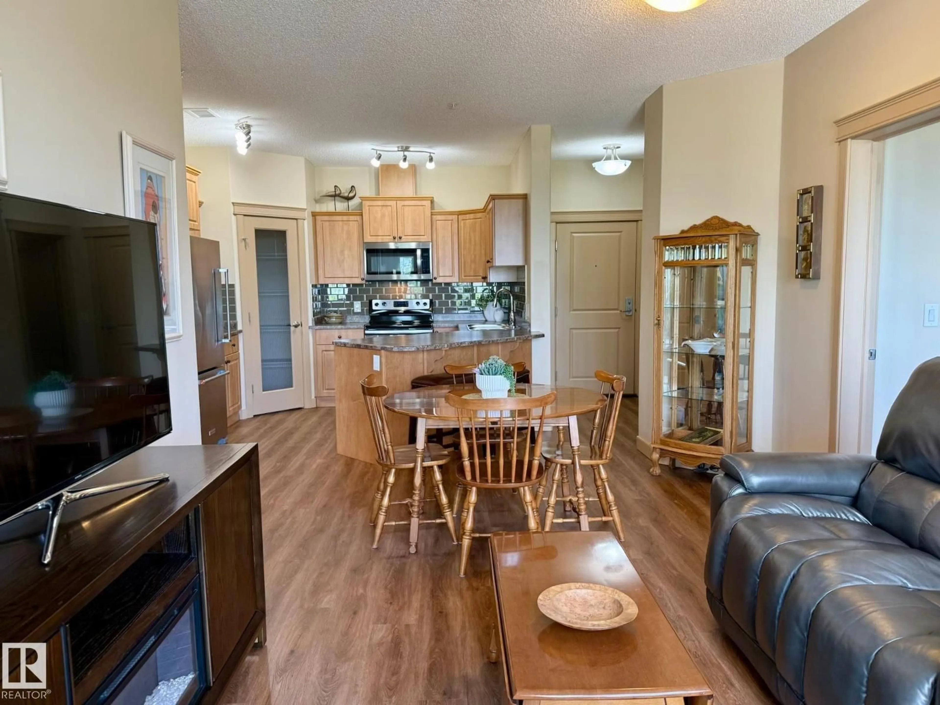 Open concept kitchen, wood/laminate floor for #207 - 4075 CLOVER BAR RD, Sherwood Park Alberta T8H0R6