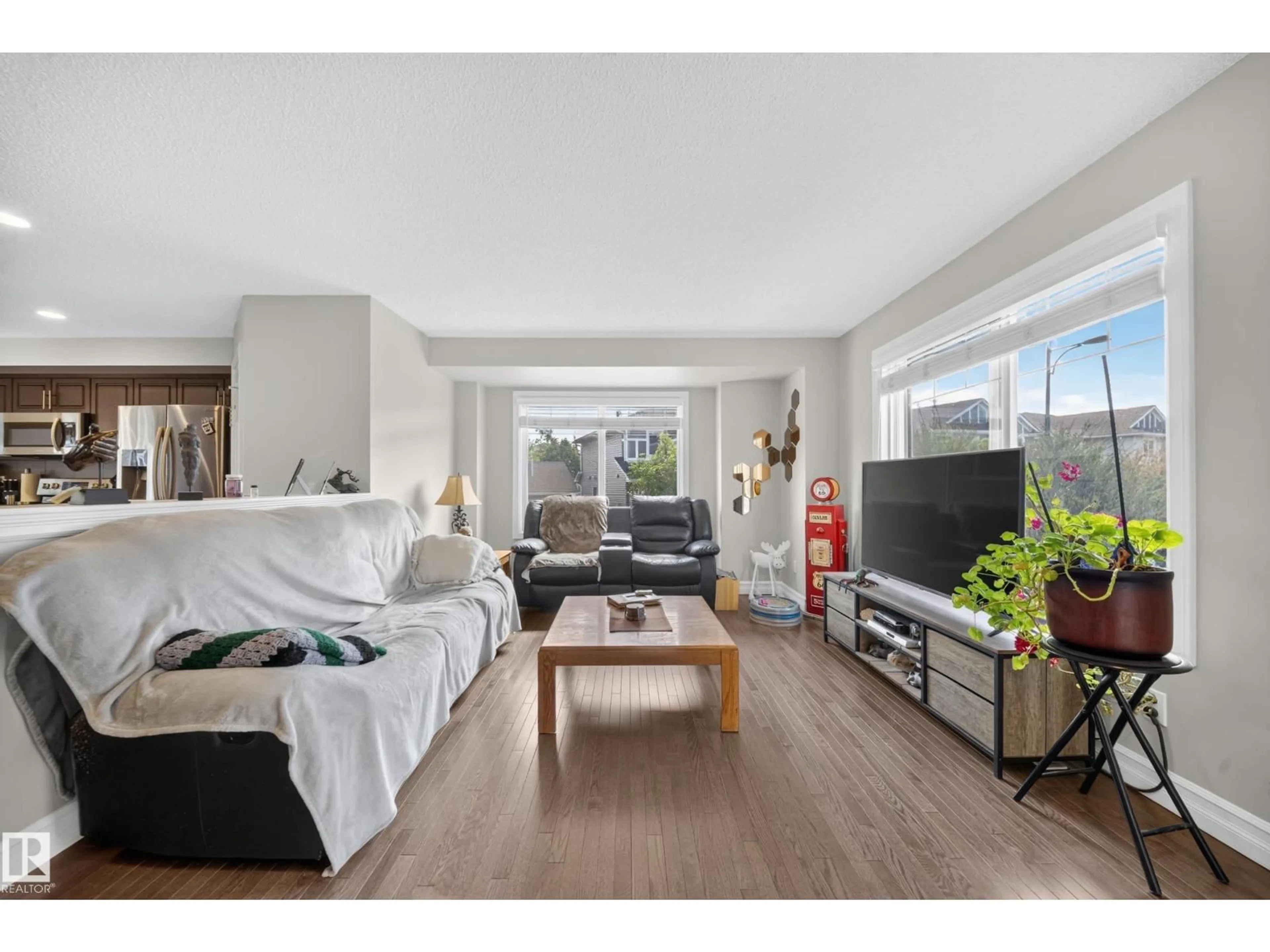 Living room with furniture, wood/laminate floor for 655 - 64 TAMARACK RD, Edmonton Alberta T6T0N4