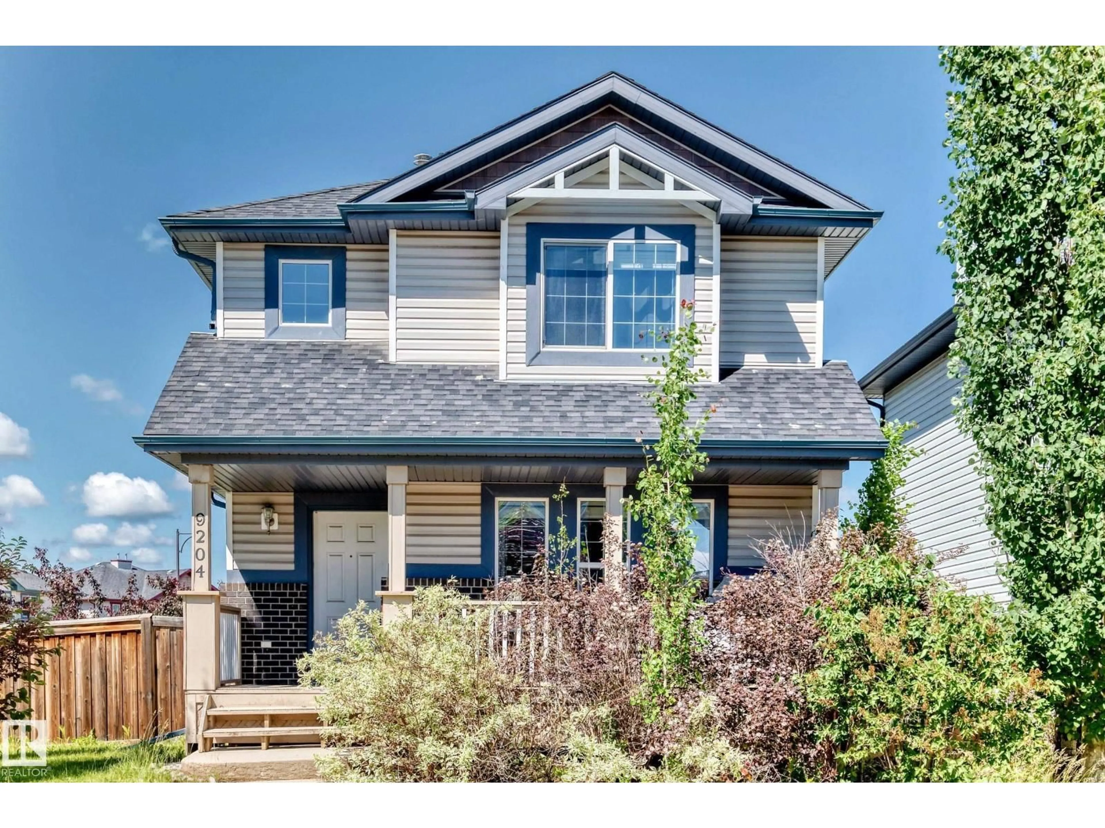 Home with vinyl exterior material, street for 9204 SCOTT LN, Edmonton Alberta T6R0E7