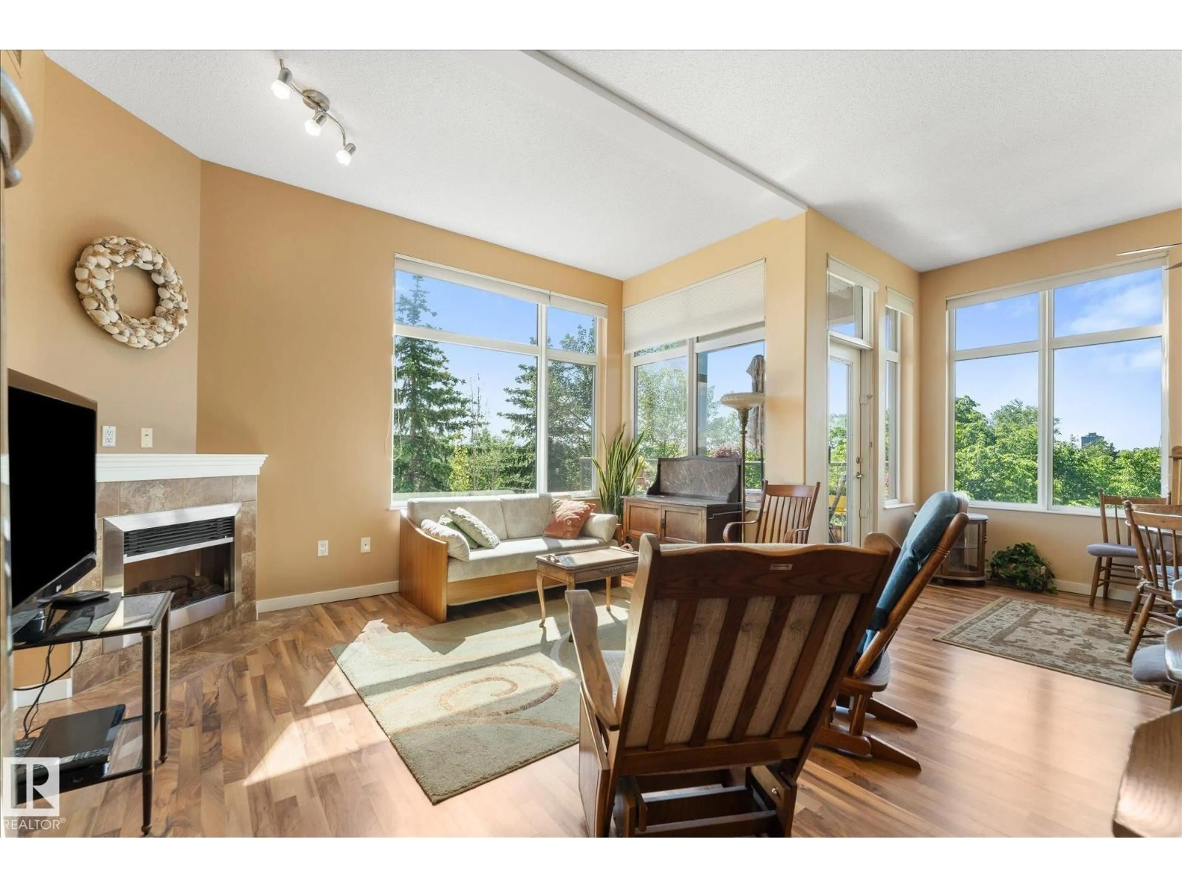 Living room with furniture, wood/laminate floor for #408 - 11140 68 AV, Edmonton Alberta T6H2C2