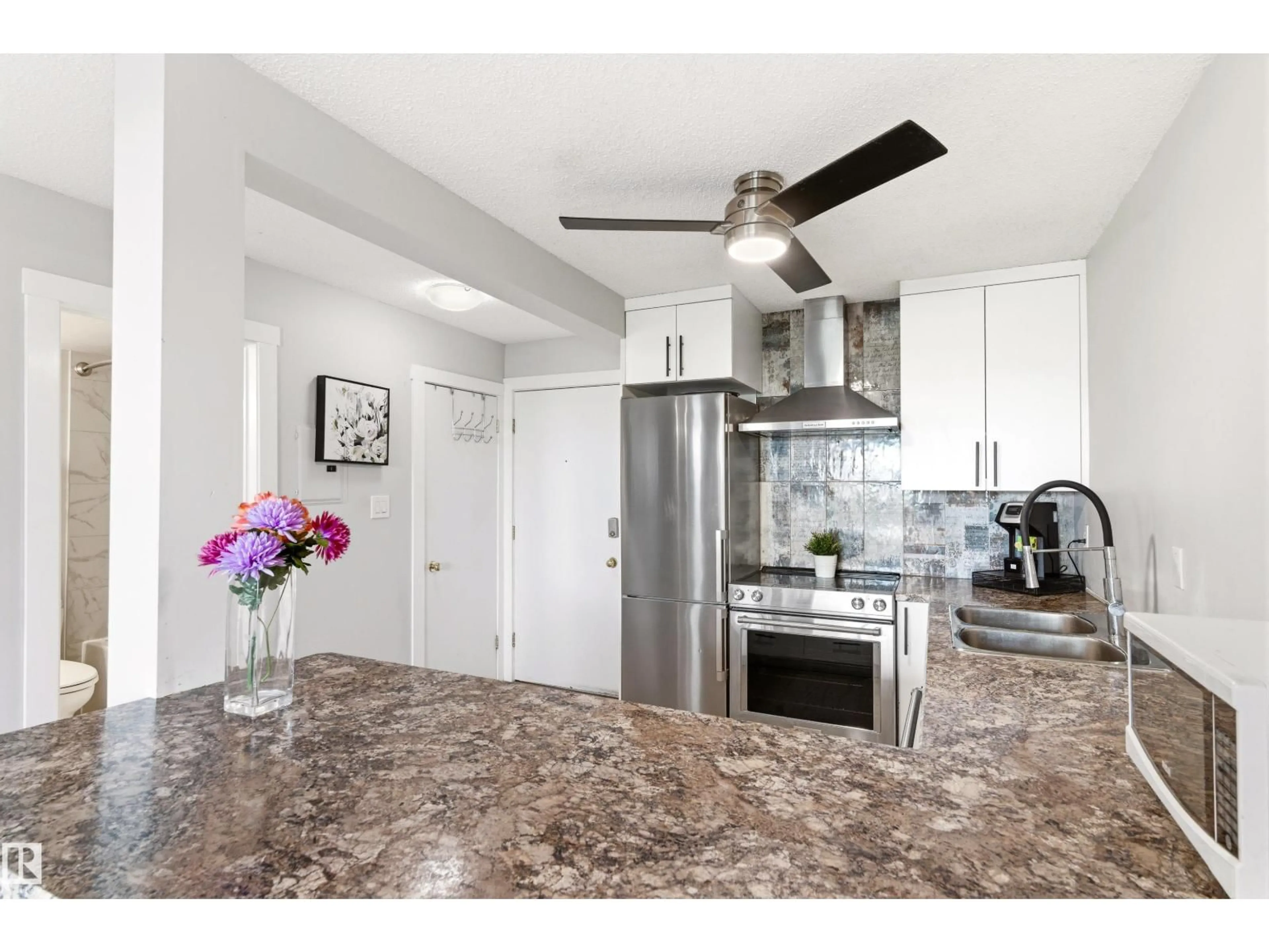Open concept kitchen, ceramic/tile floor for 105 - 10230 120 STREET NW, Edmonton Alberta T5K2A3