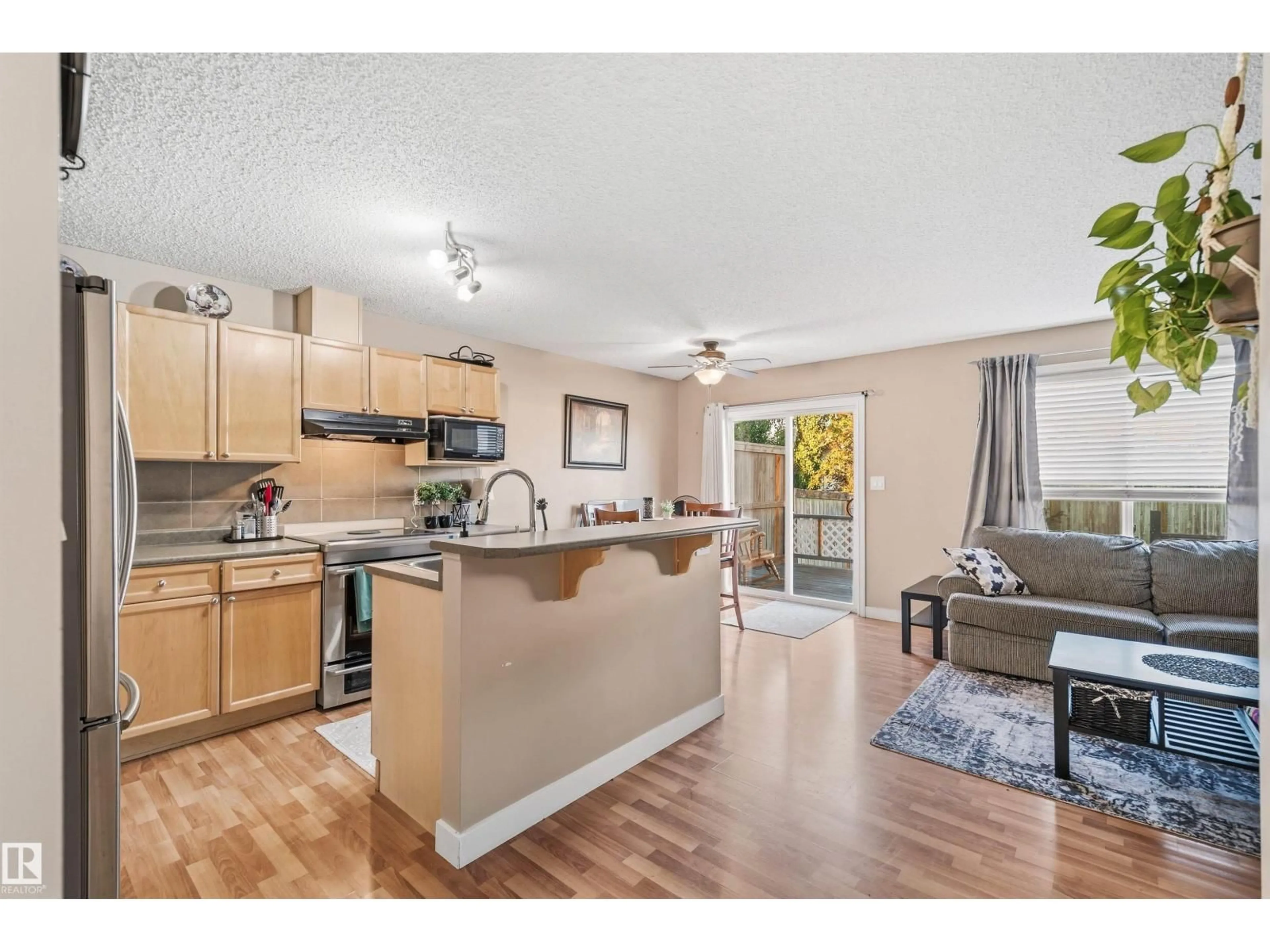 Open concept kitchen, wood/laminate floor for 21207 90 AVE, Edmonton Alberta T5T6Z1