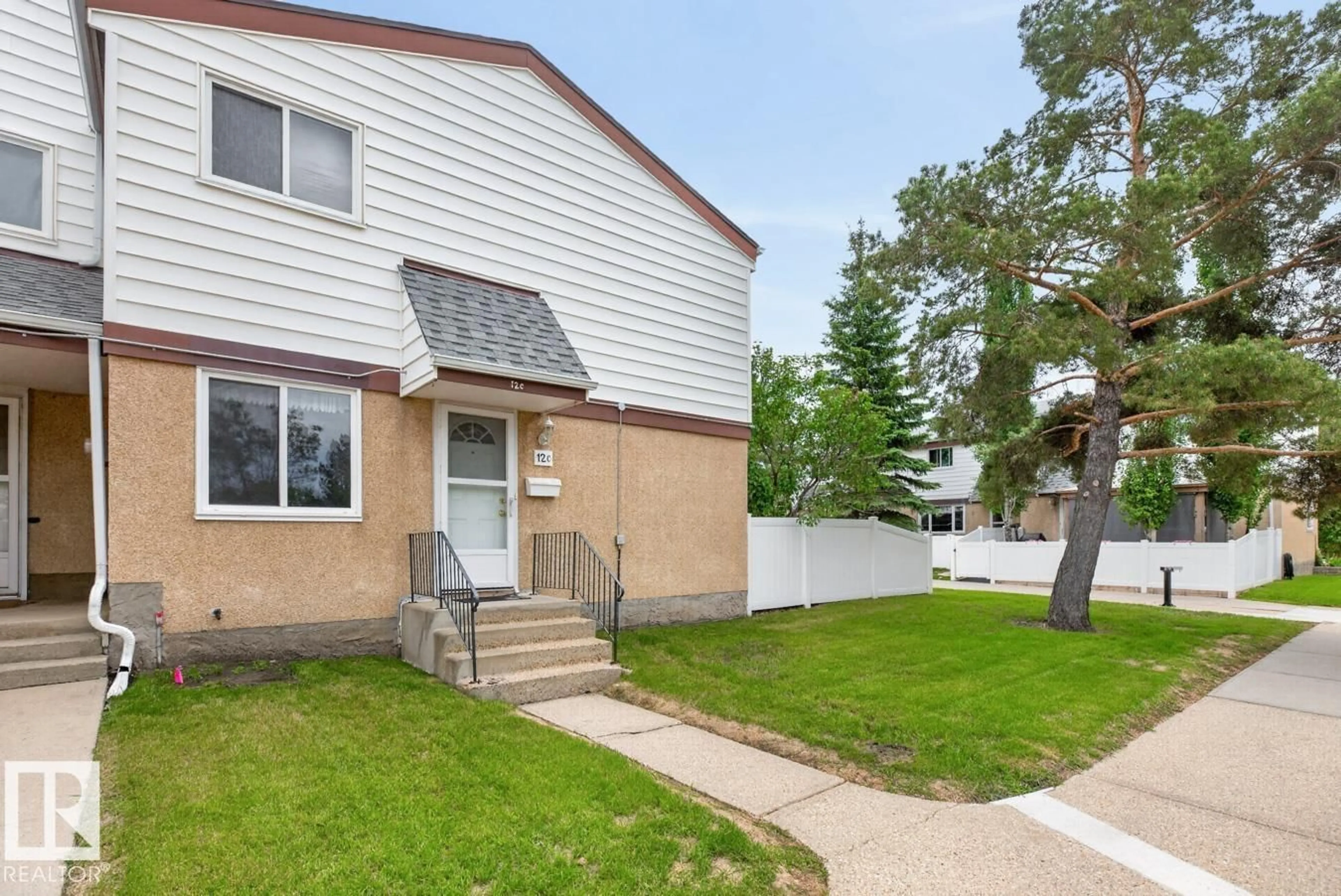 Home with vinyl exterior material, street for 12C TWIN TC NW, Edmonton Alberta T6K1V4