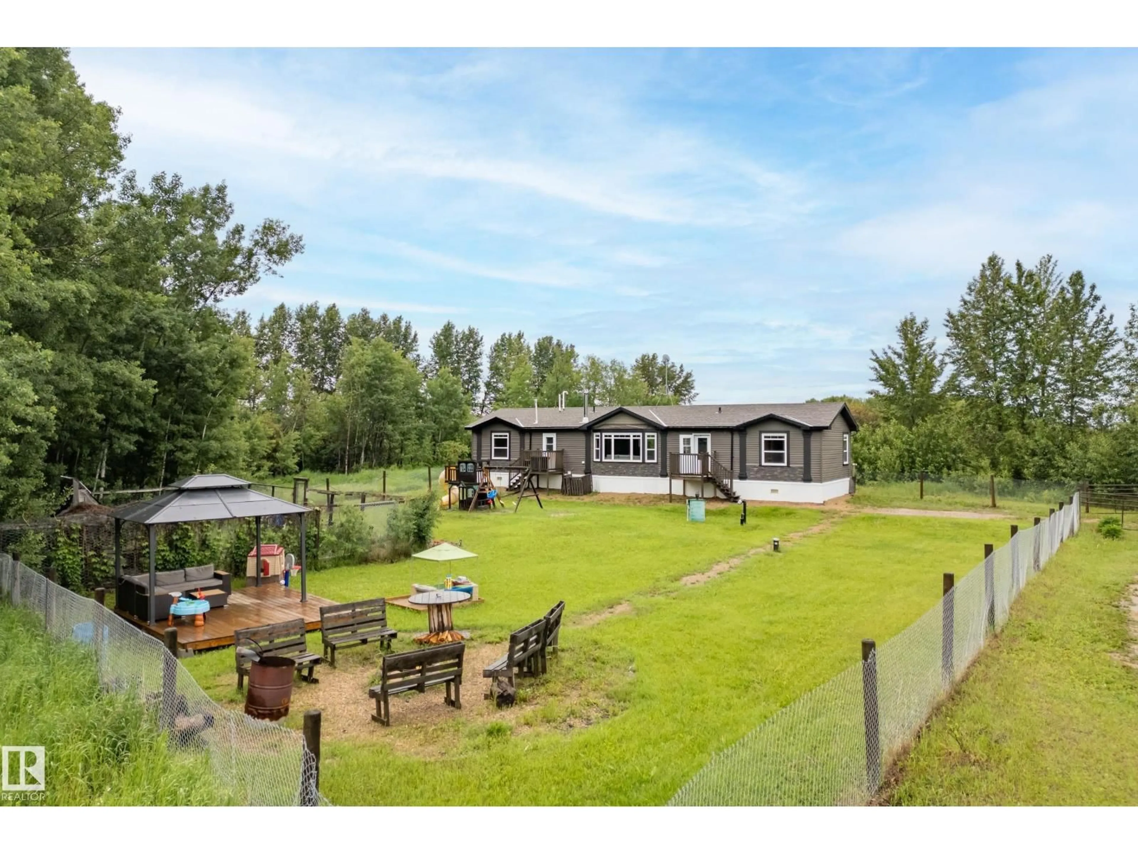 A pic from outside/outdoor area/front of a property/back of a property/a pic from drone, mountain view for 59415 RANGE ROAD 243, Rural Westlock County Alberta T0G0P0